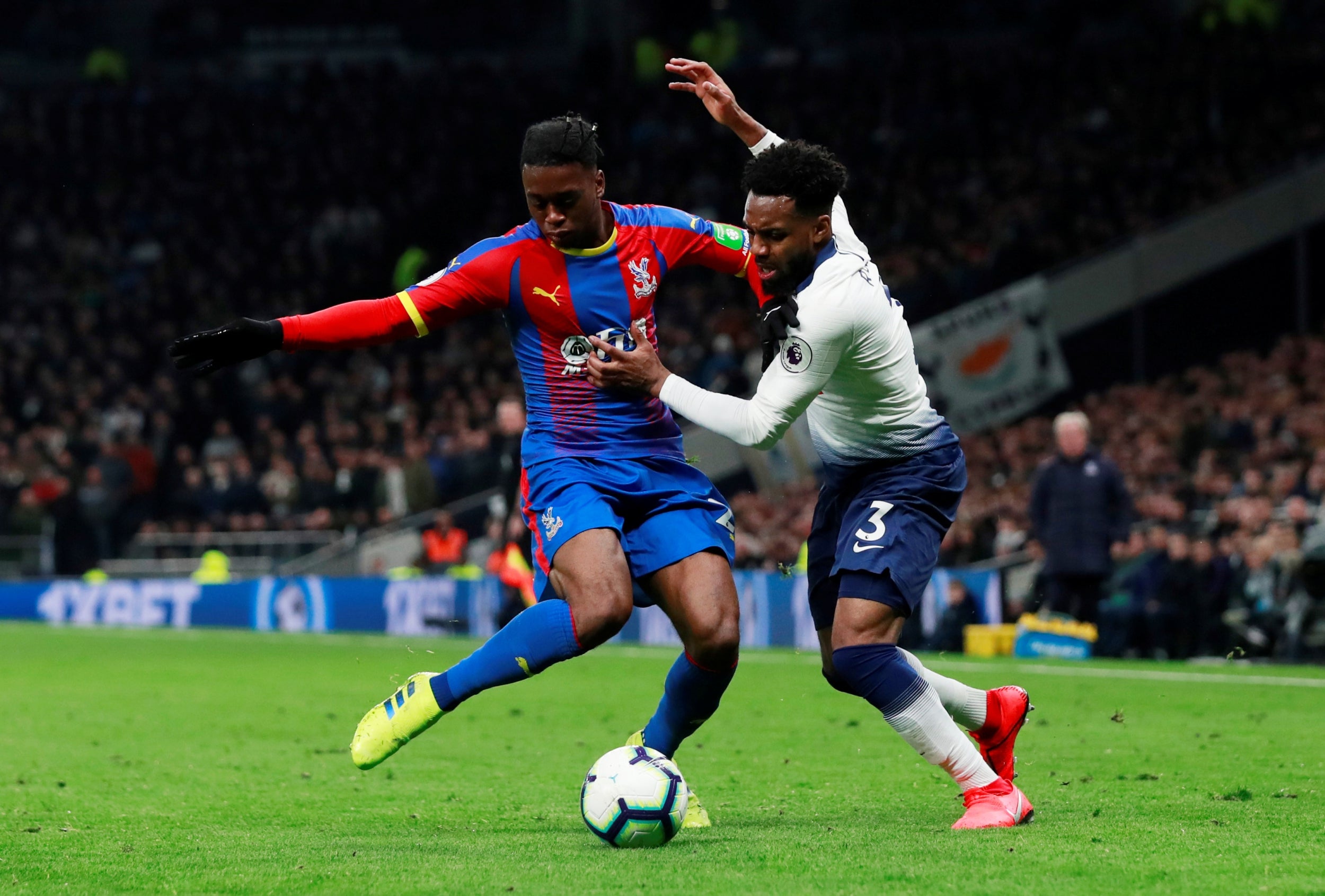 Wan Bissaka and Rose tussle for possession during the first half