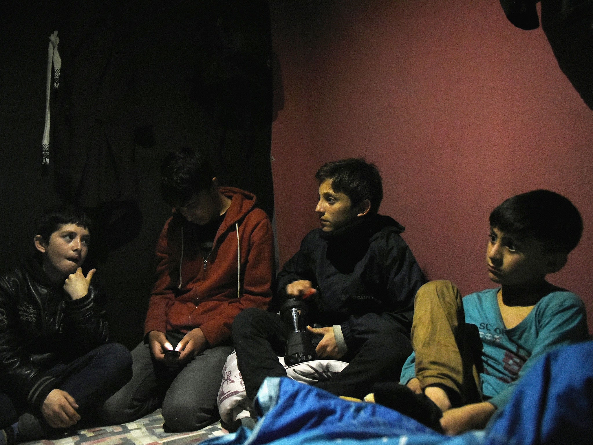 A group of unaccompanied child asylum seekers from Afghanistan at The Jungle migrant camp in Calais