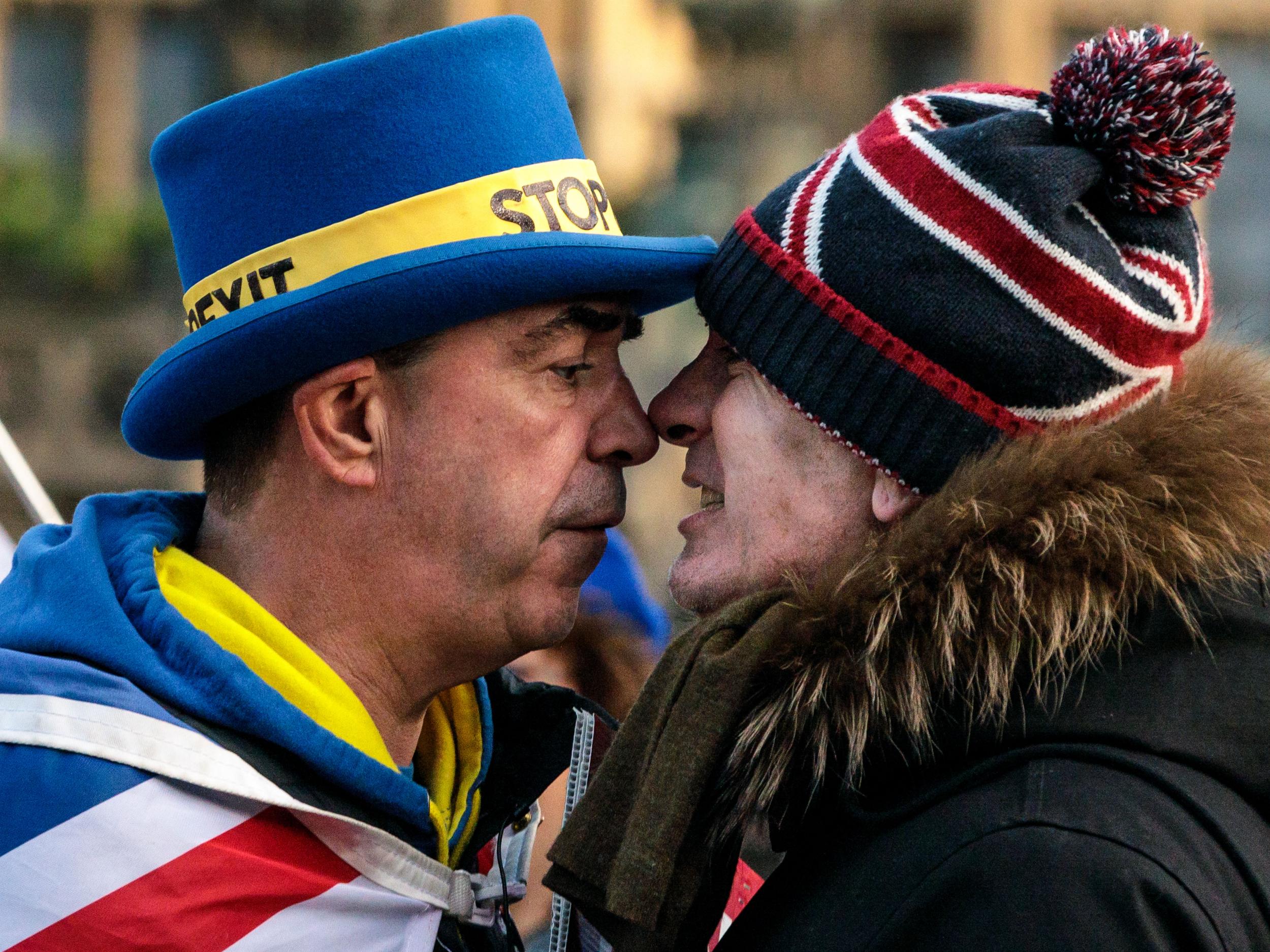 Two Brexit protesters face off outside parliament