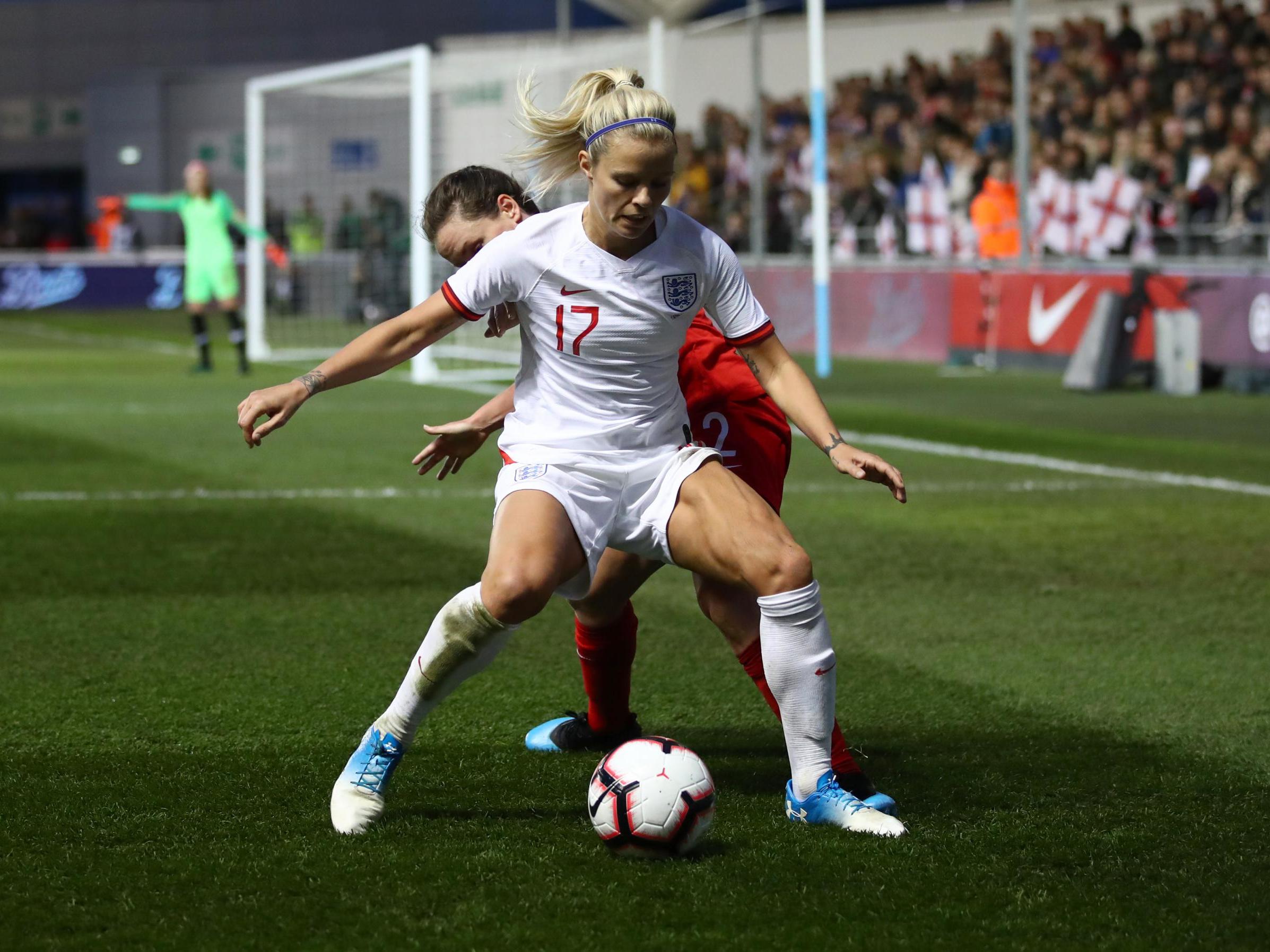 Rachel Daly of England shields the ball from Allysha Chapman