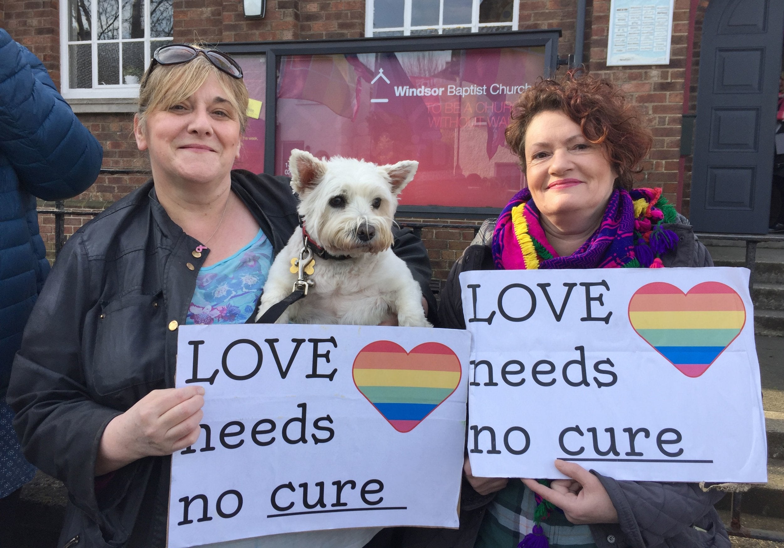 Shirley McPhearson (left) with her dog Molly and Helen Crickard joins campaigners for LGBT+ rights outside Windsor Baptist Church in Belfast