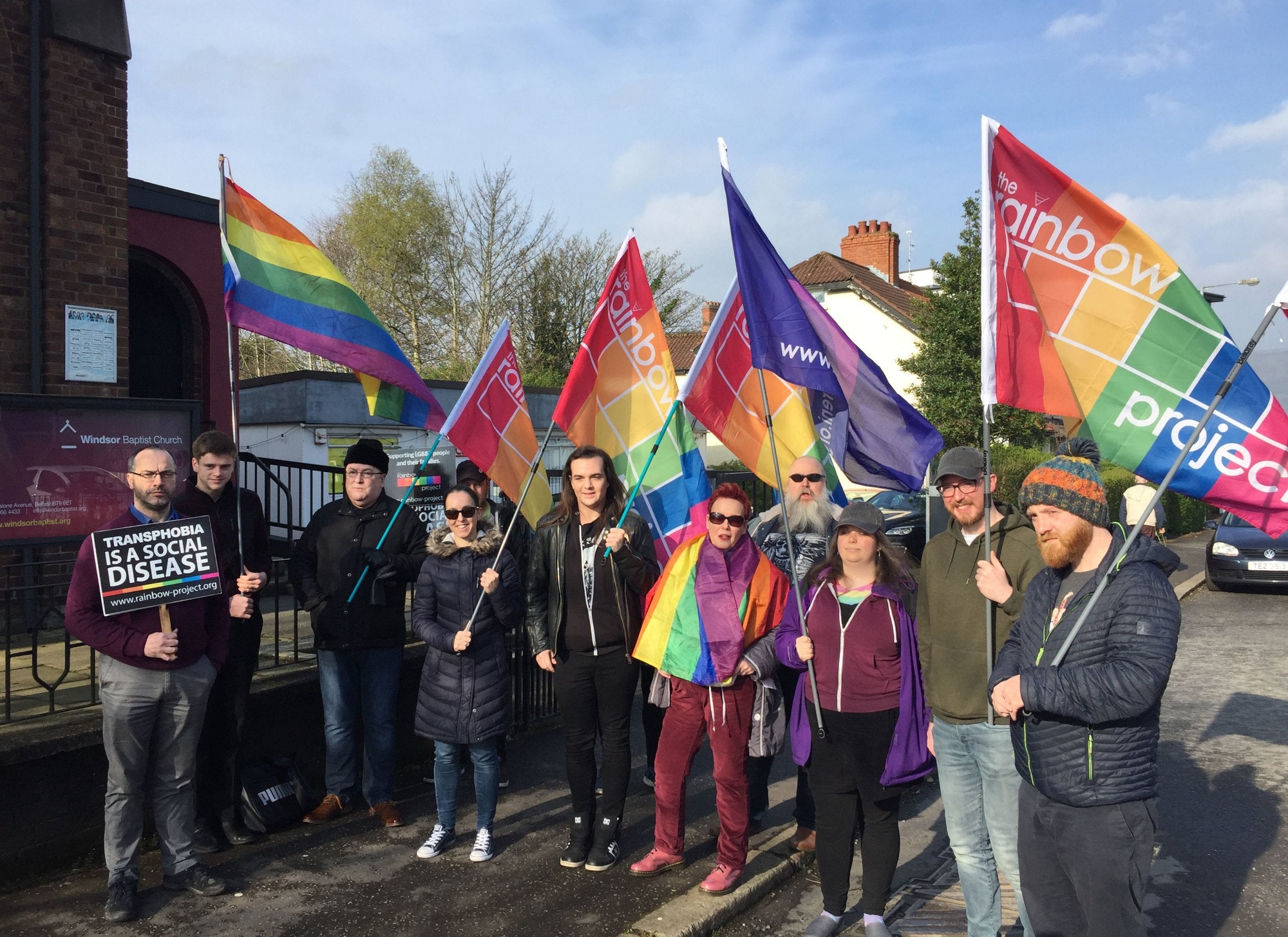 LGBT+ rights campaigners protest outside Windsor Baptist Church in Belfast