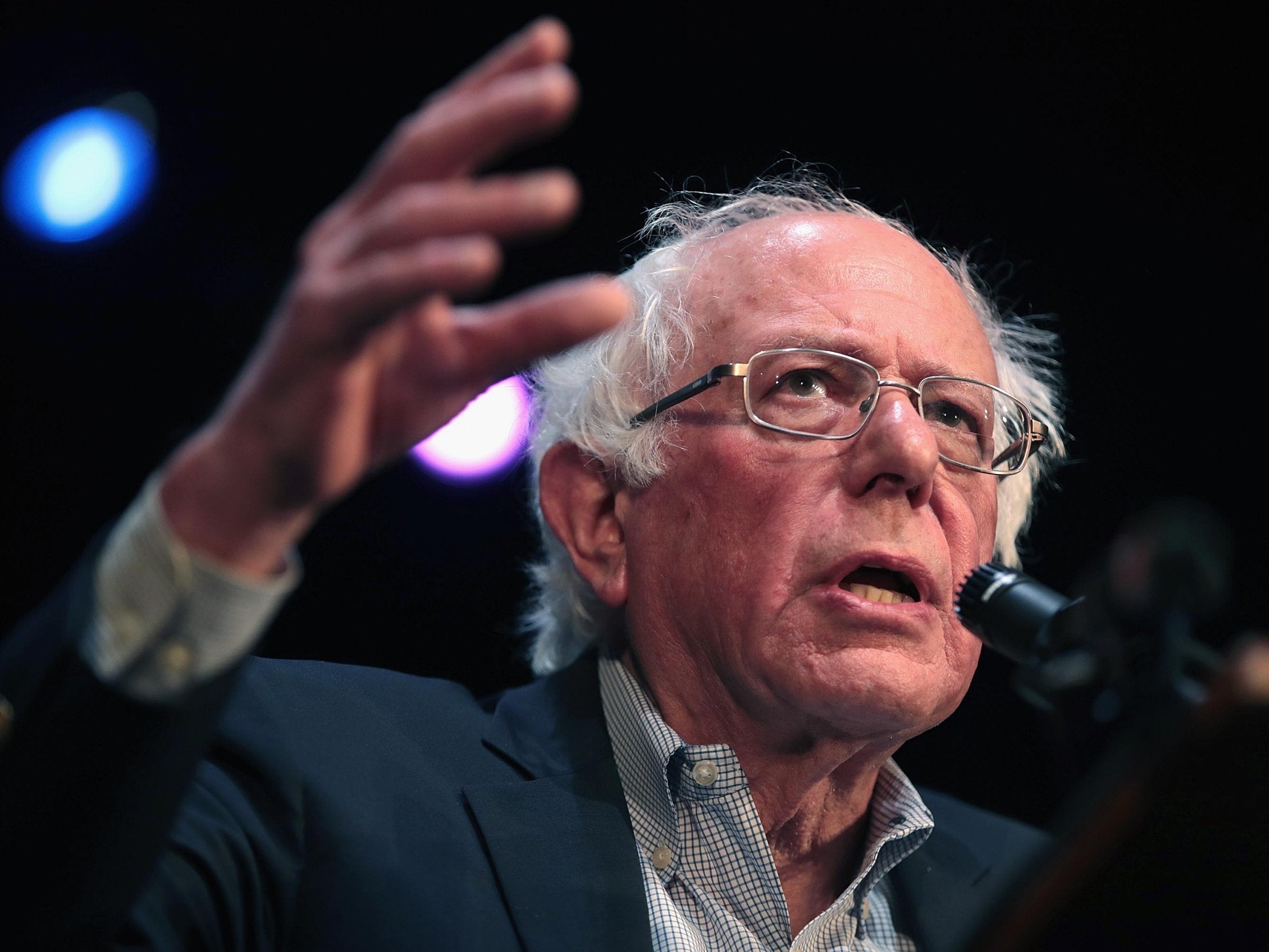 Democratic presidential candidate senator Bernie Sanders says policy will be funded by a new tax on Wall Street speculation