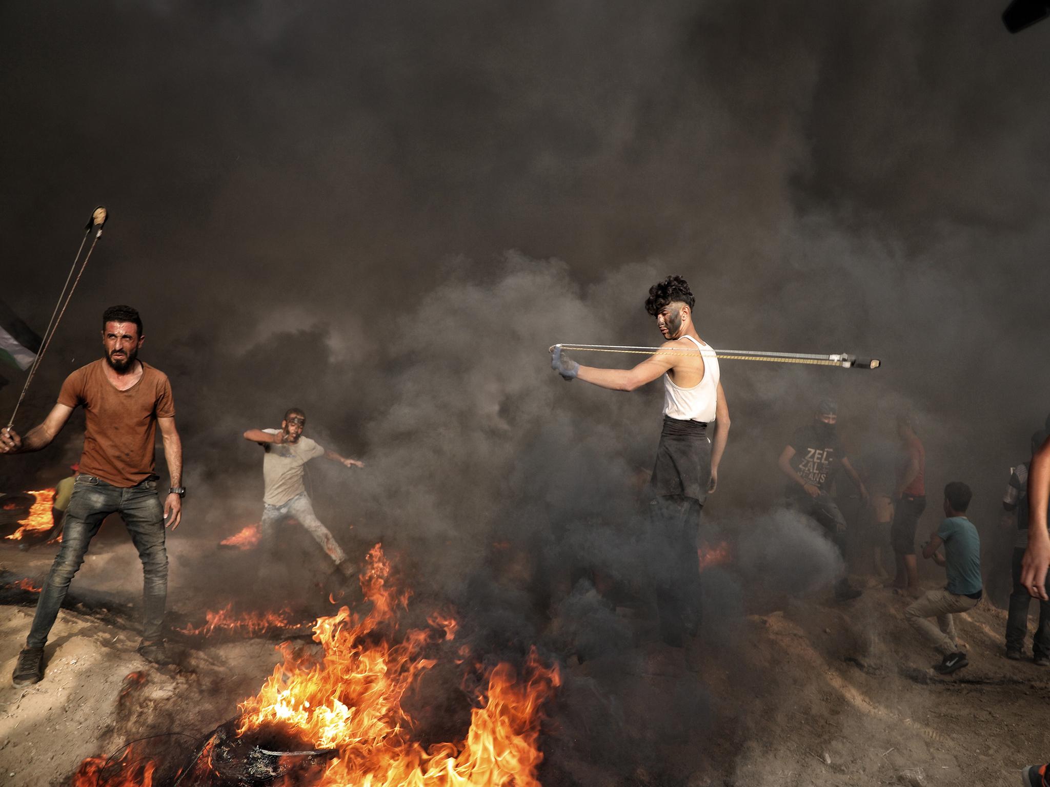 Mohammed Bourdaini, 18, protests at the Israel-Gaza border in October 2018. He was hit in the leg by a bullet last month.