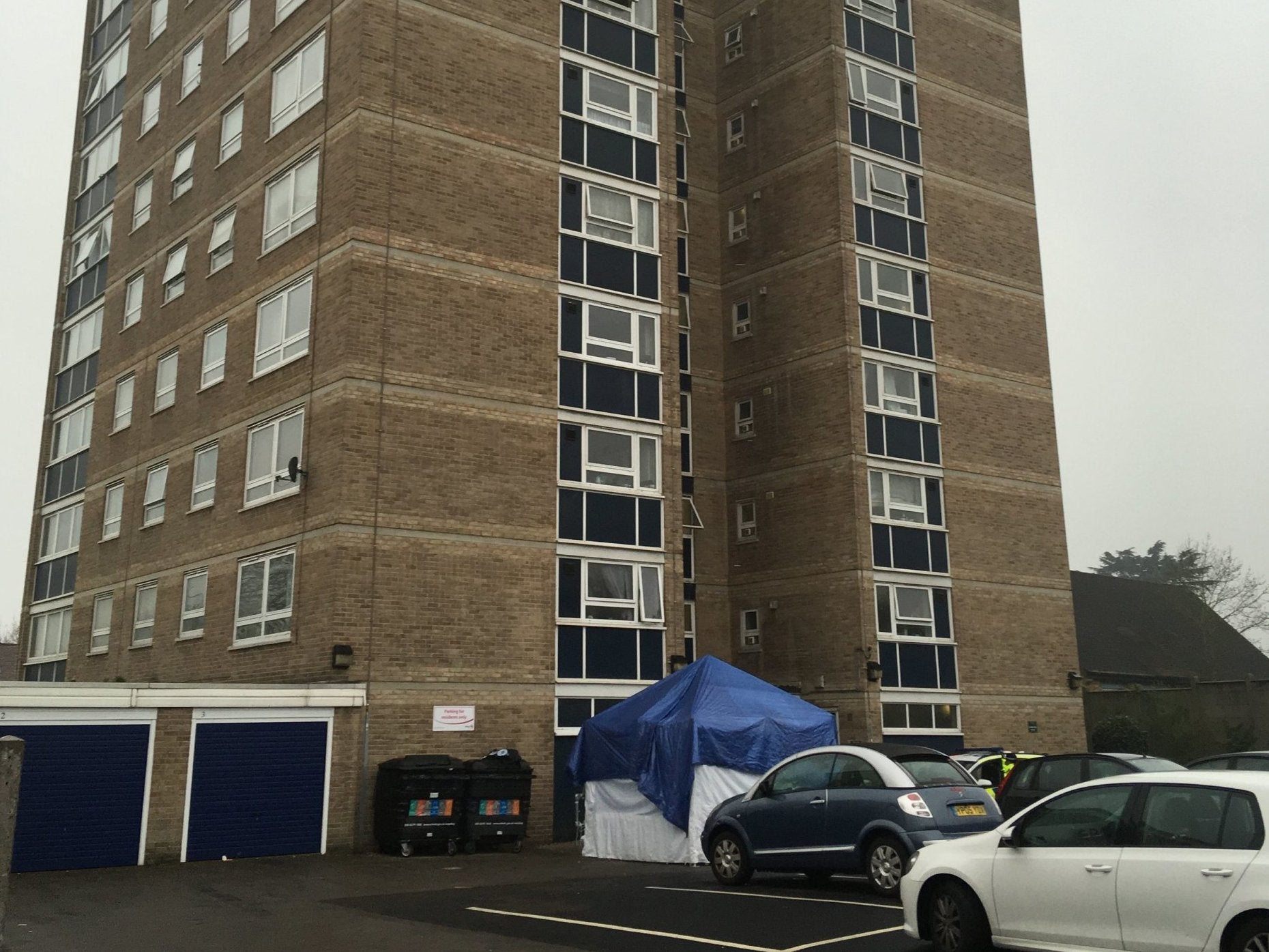 A police crime scene tent outside the entrance to a block of flats in Brookbank, Turkey Street, Enfield, north London, where a woman died on 7 April 2019.