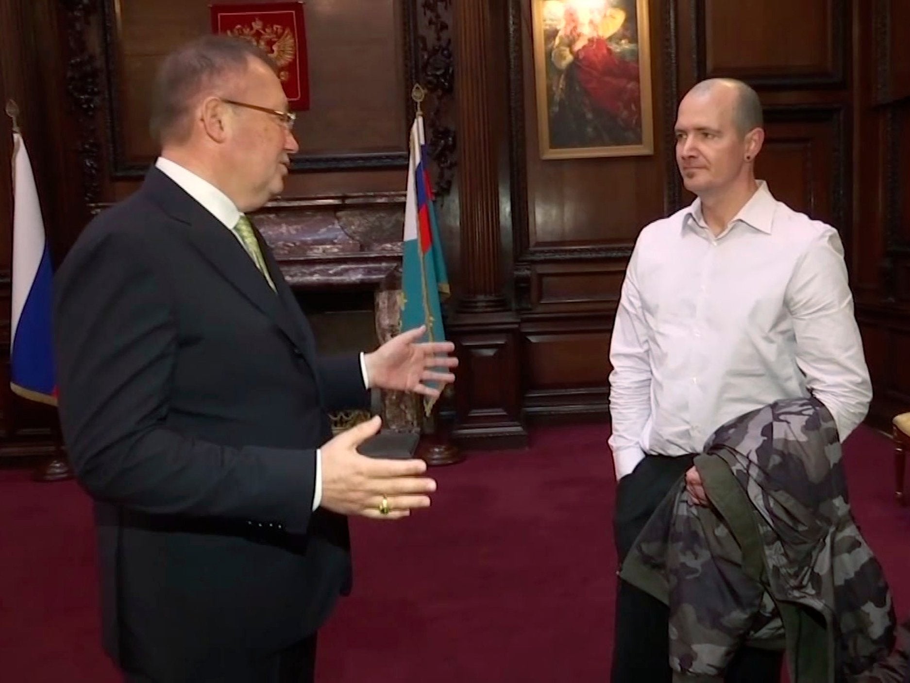 Russian ambassador to the UK Alexander Yakovenko, left, meets with Novichok poisoning victim Charlie Rowley.