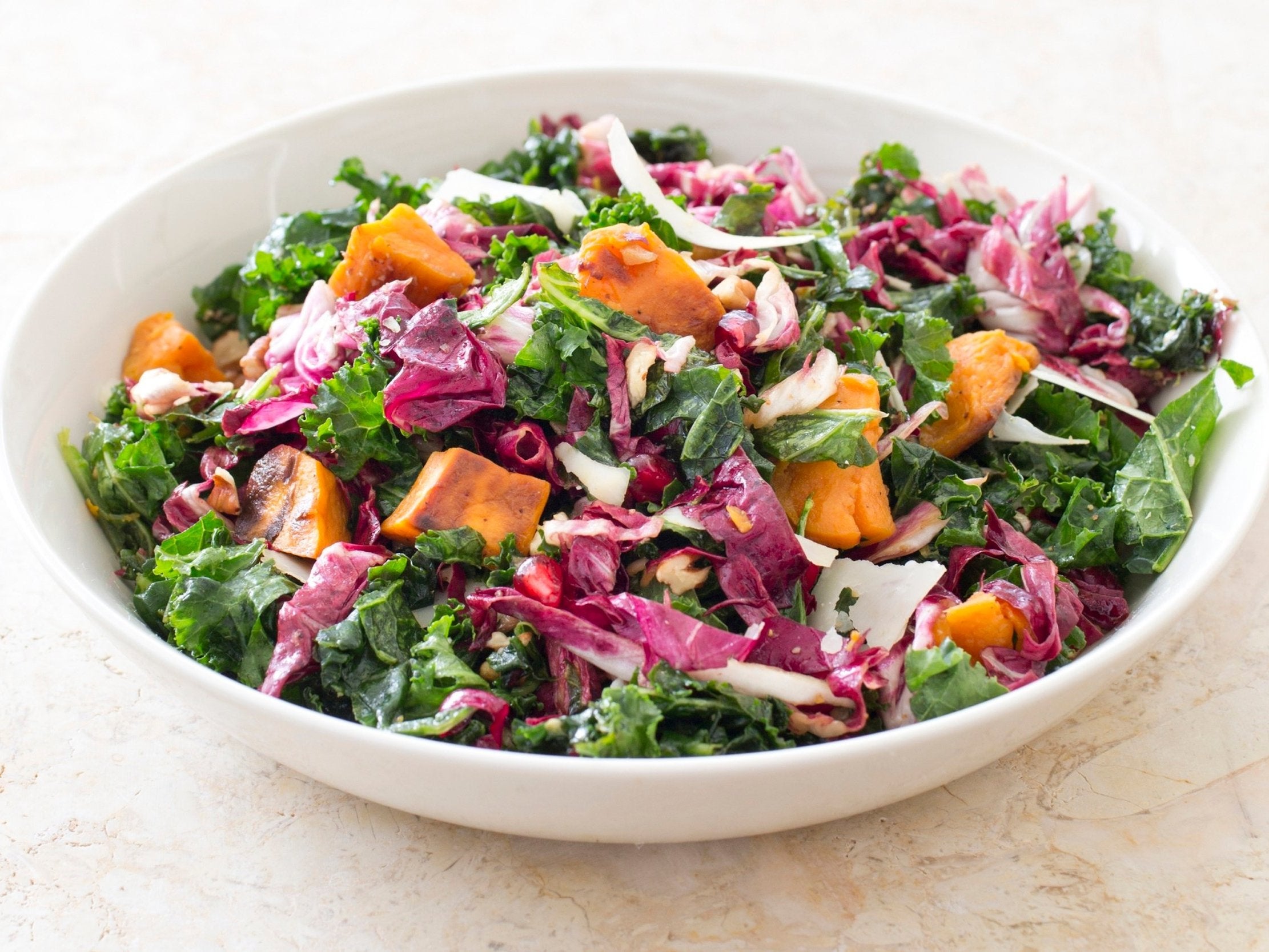 Pictured: kale salad with sweet potatoes. The study alleges women are drawn to healthy food, while men more likely to spend their money on vitamins, protein powders and exercise supplements.