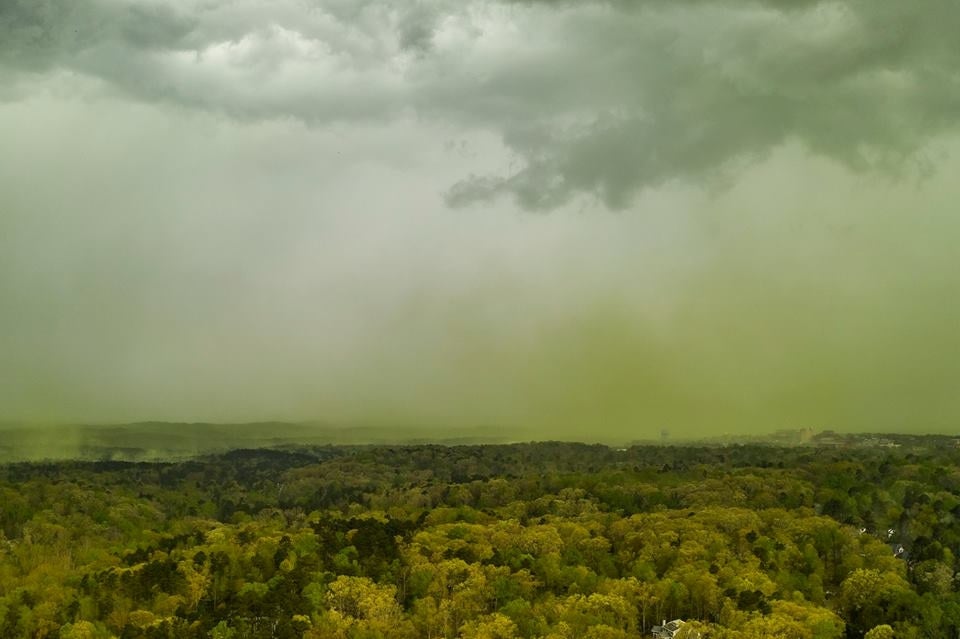 Dark clouds glower over the green haze over an area in Durham, North Carolina
