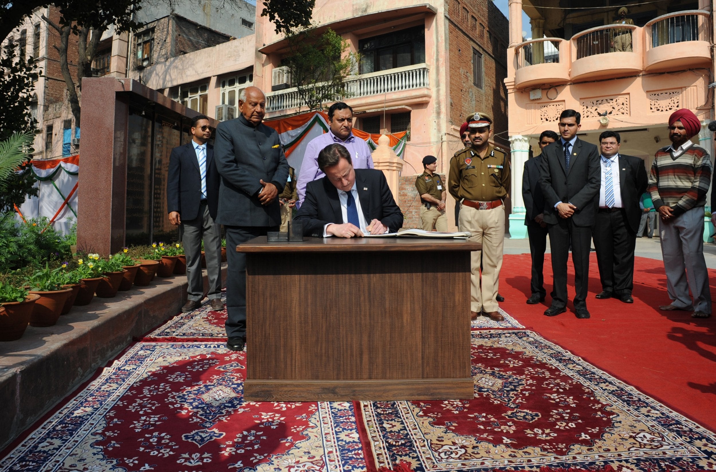 David Cameron pays his respects at the Jallianwala Bagh memorial garden, the first British prime minister to do so