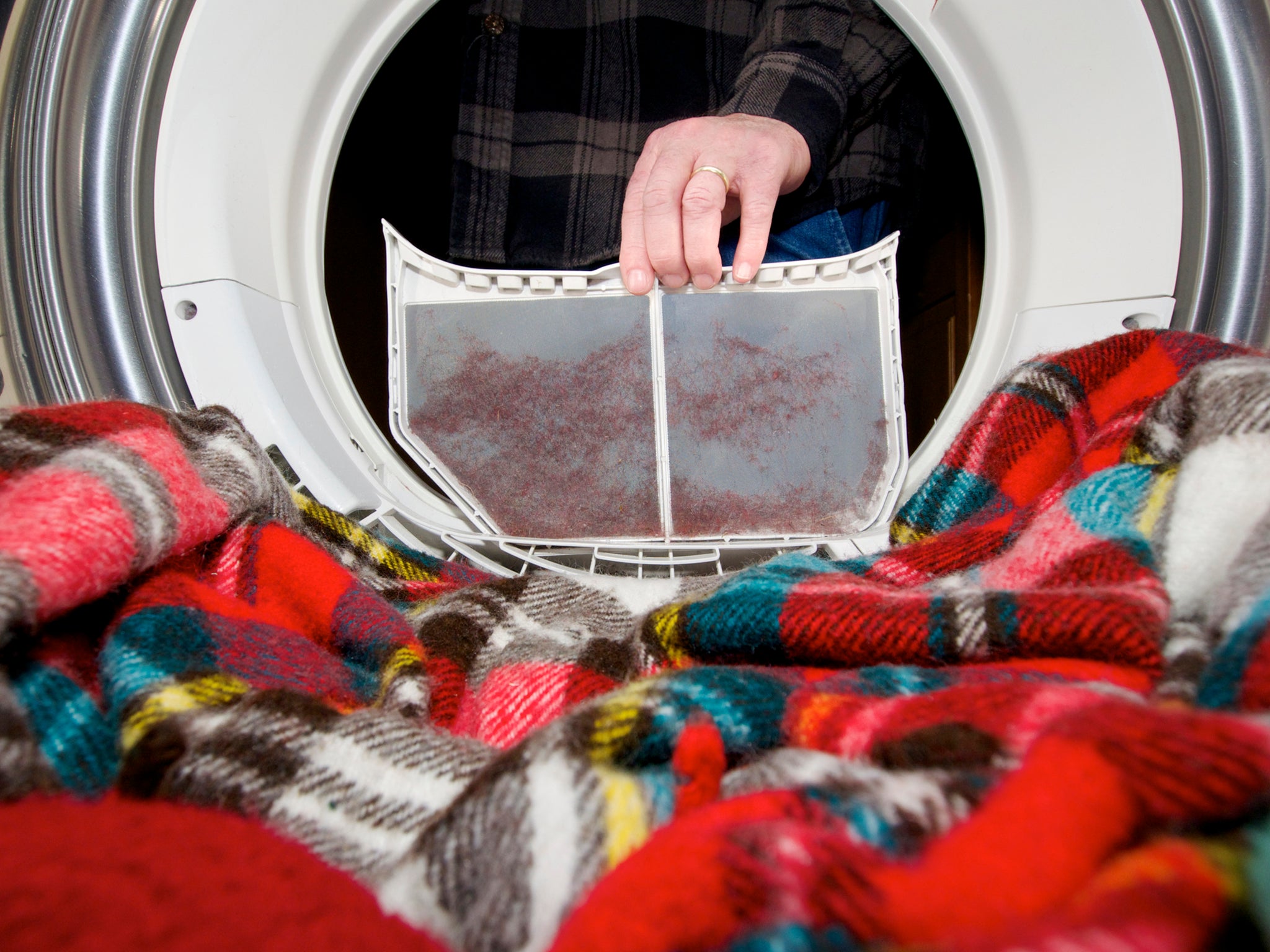 Make sure to empty the lint trap before every dryer load (Getty/iStock)