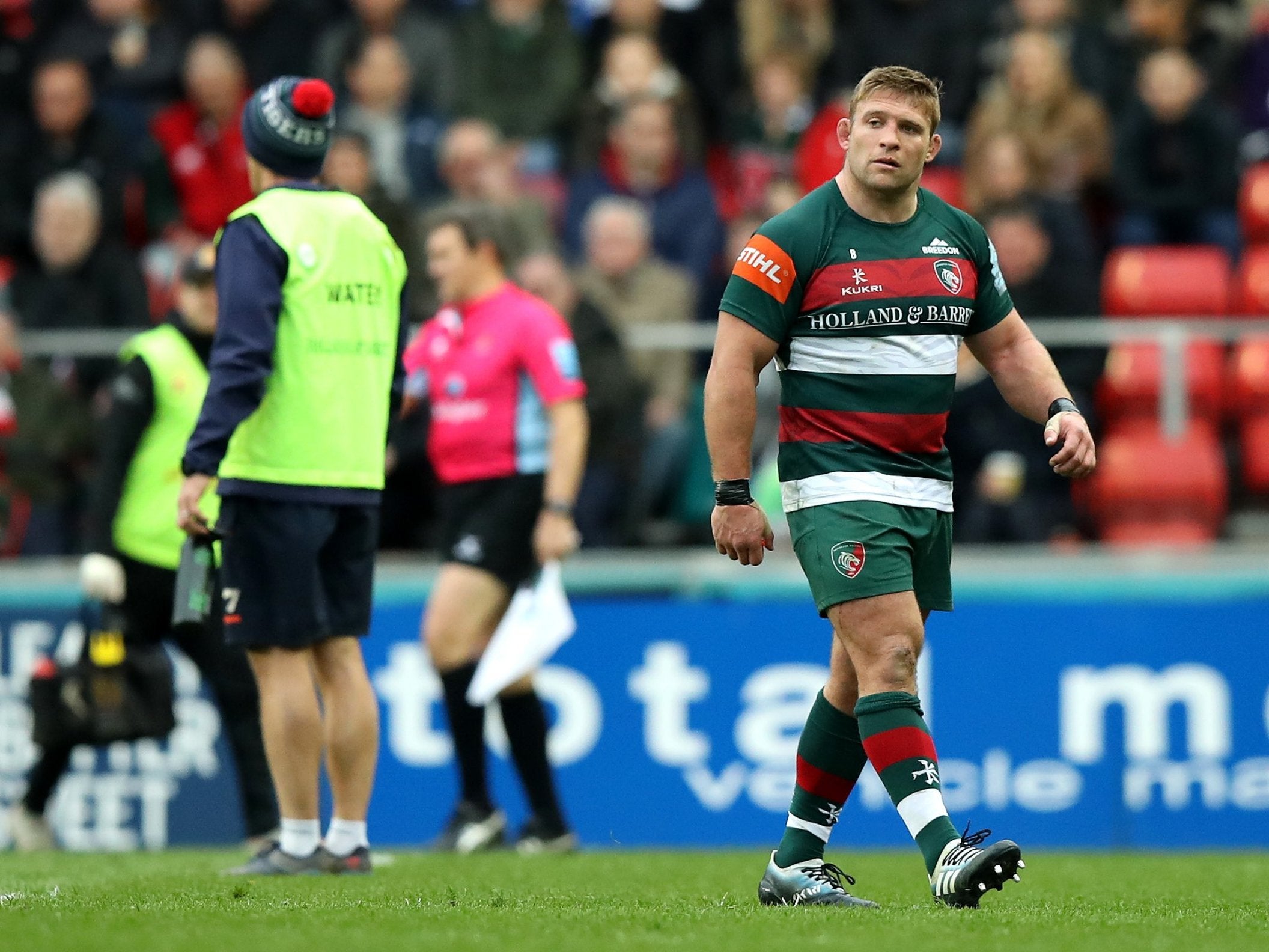 Tom Youngs walks off the pitch after being shown a red card