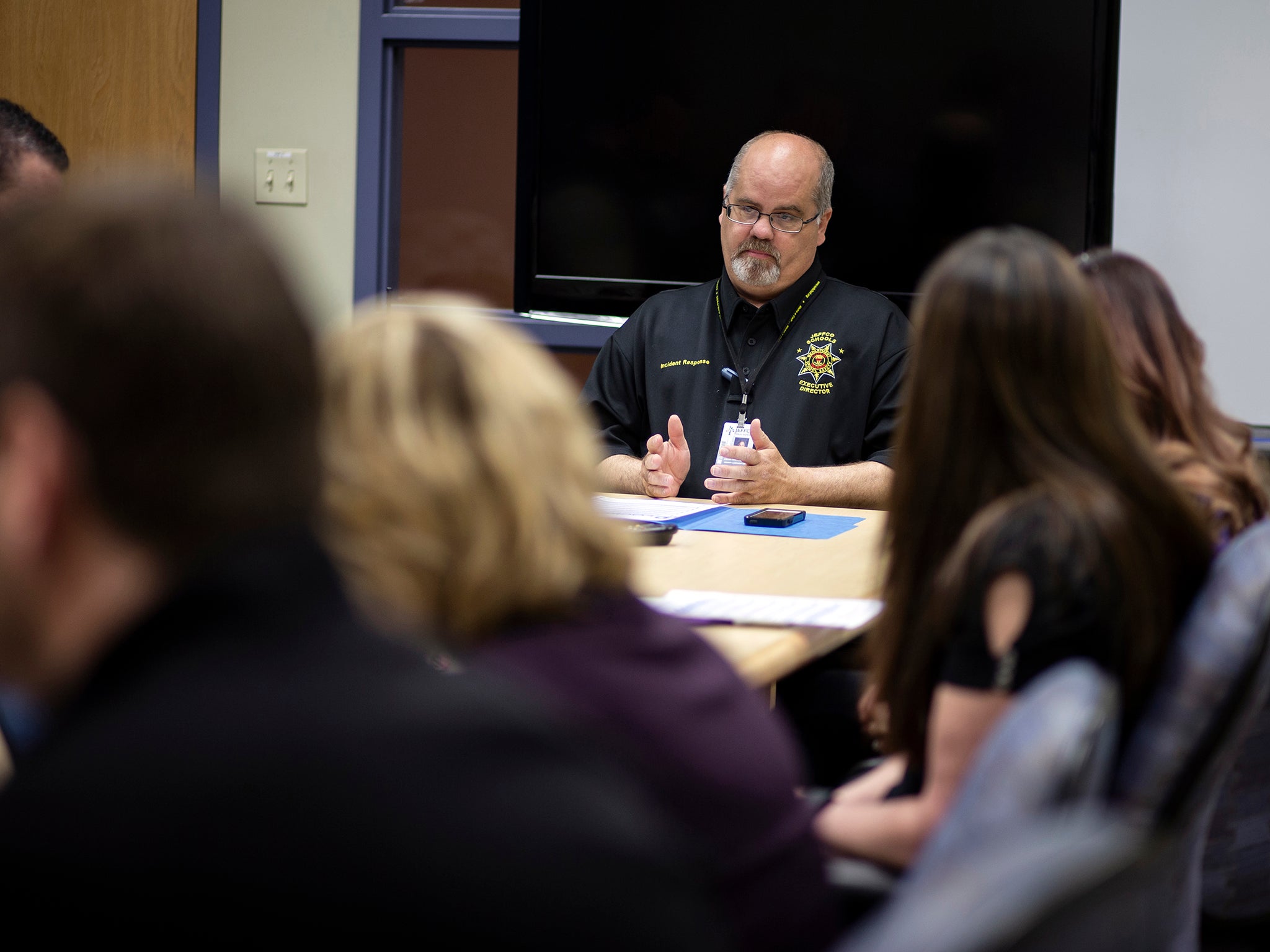 McDonald leads a security team meeting at the Jefferson County Schools building in Lakewood