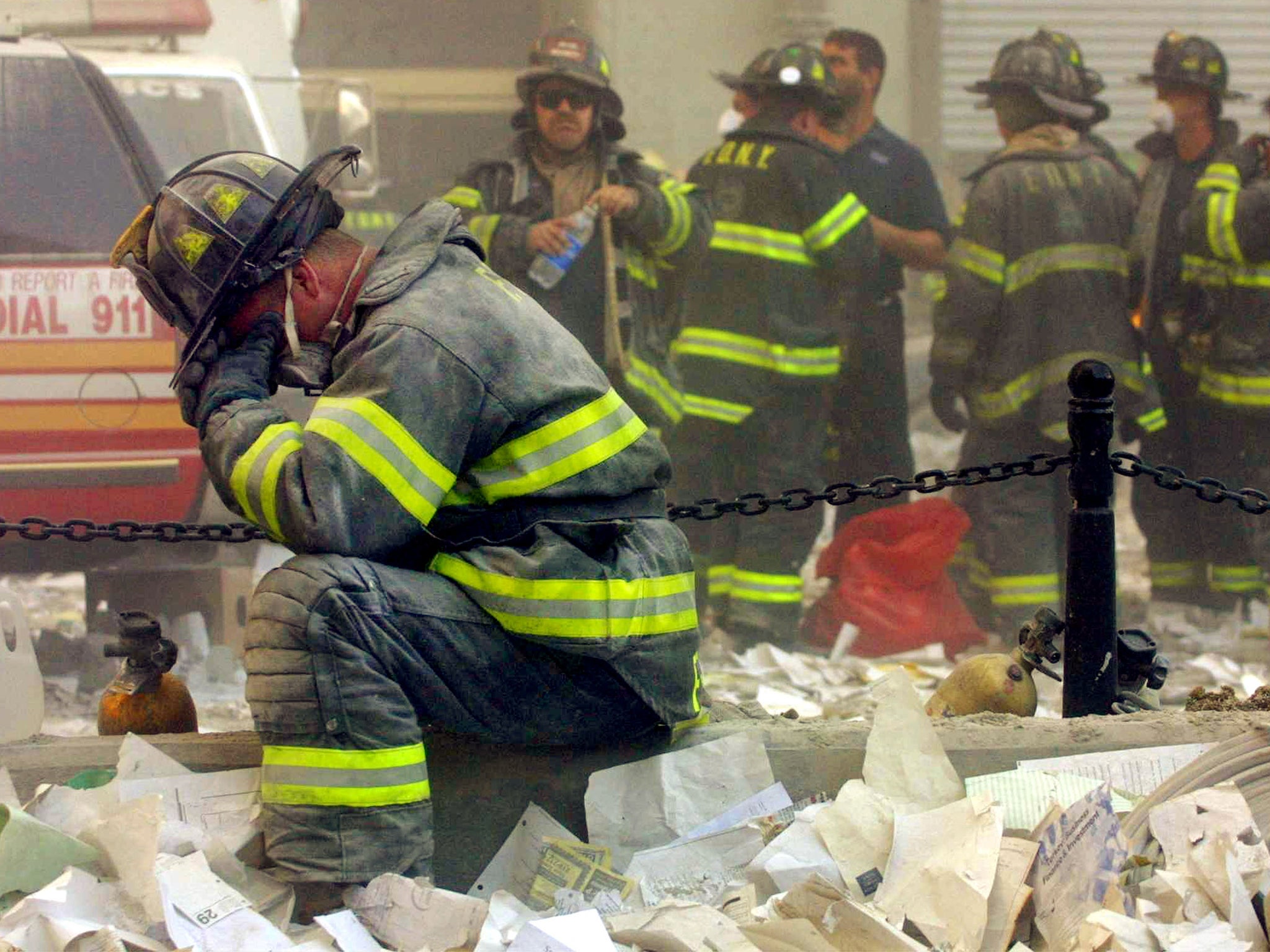 A firefighter breaks down after the Twin Towers collapse (Getty)