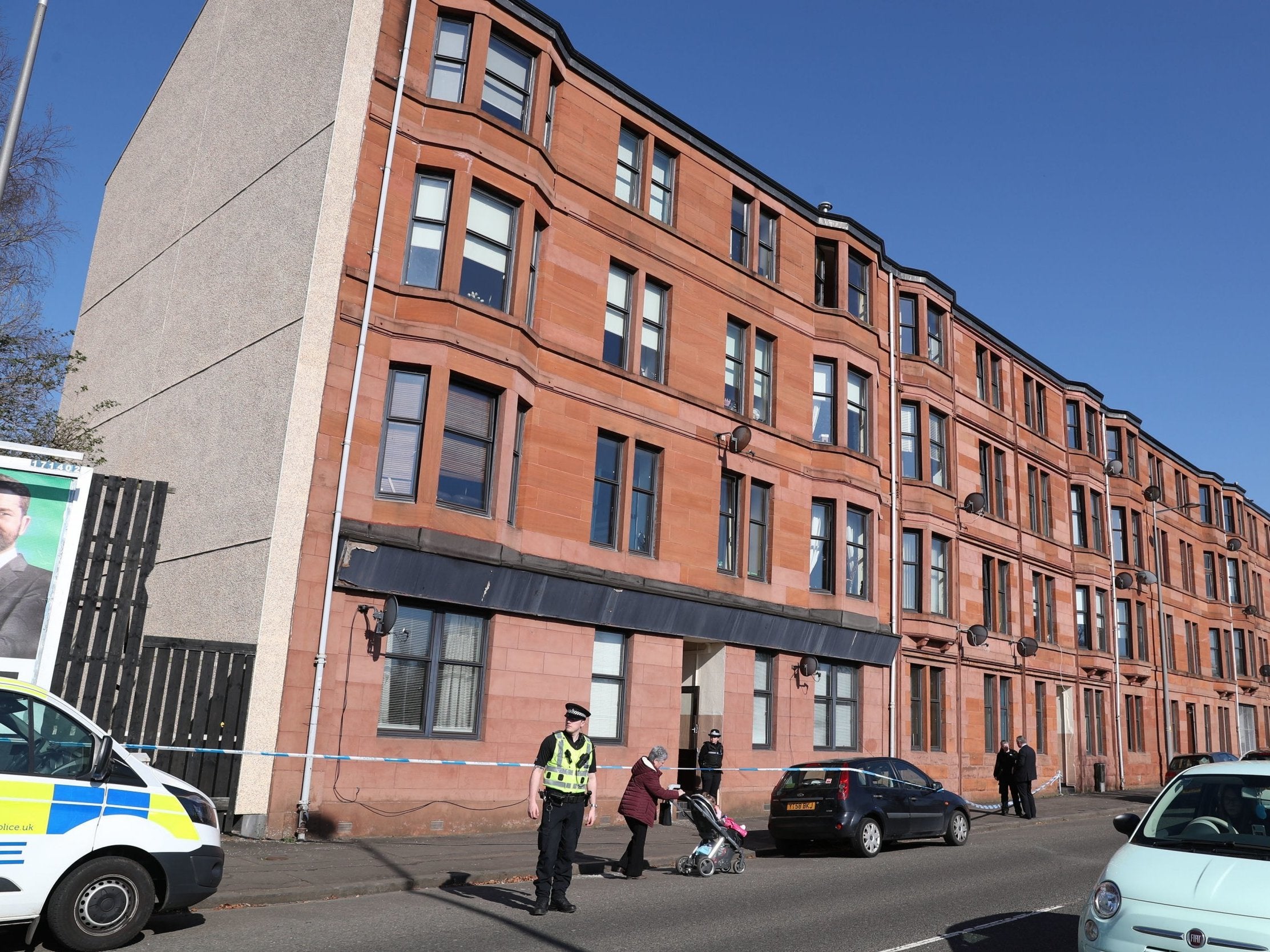 Police outside the block of flats in Clydebank, West Dunbartonshire