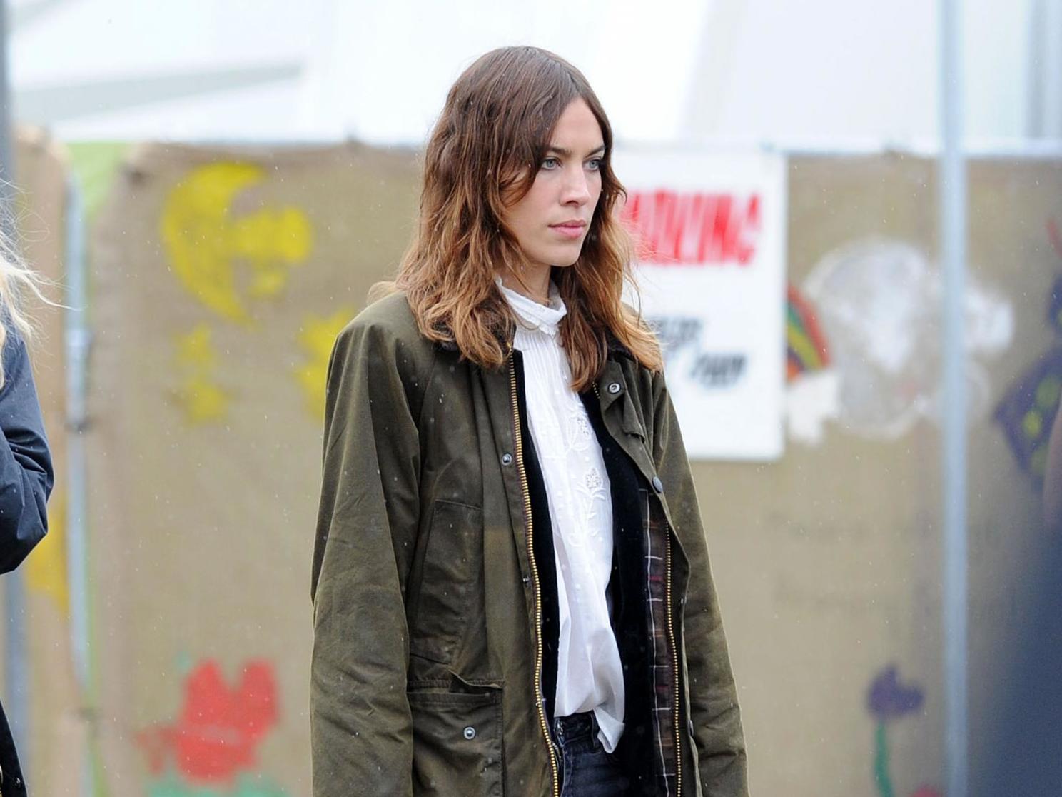 Chung pictured wearing a Barbour jacket backstage at Glastonbury Festival in 2014.