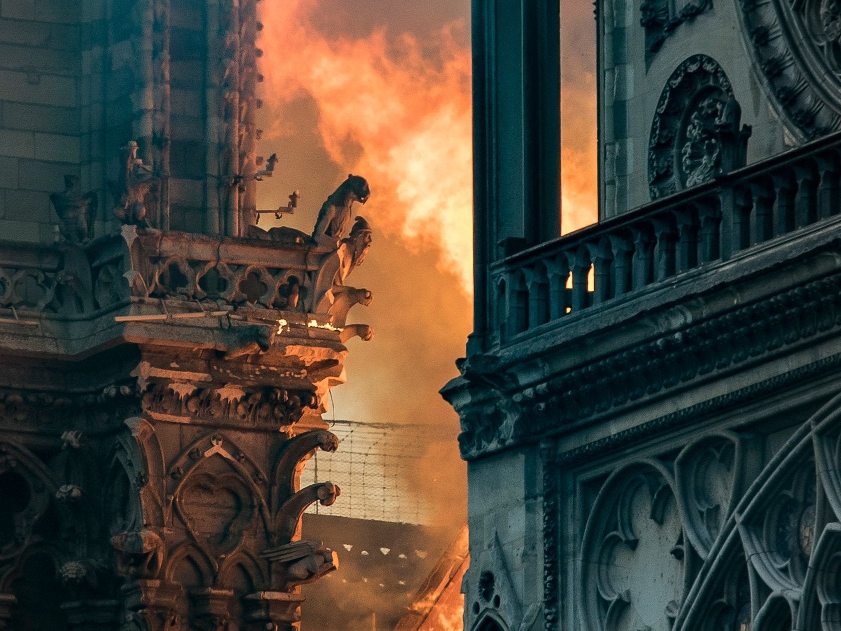 Flames and smoke billow around the gargoyles decorating the roof of the Notre Dame after a fire broke out on 5 April 2019