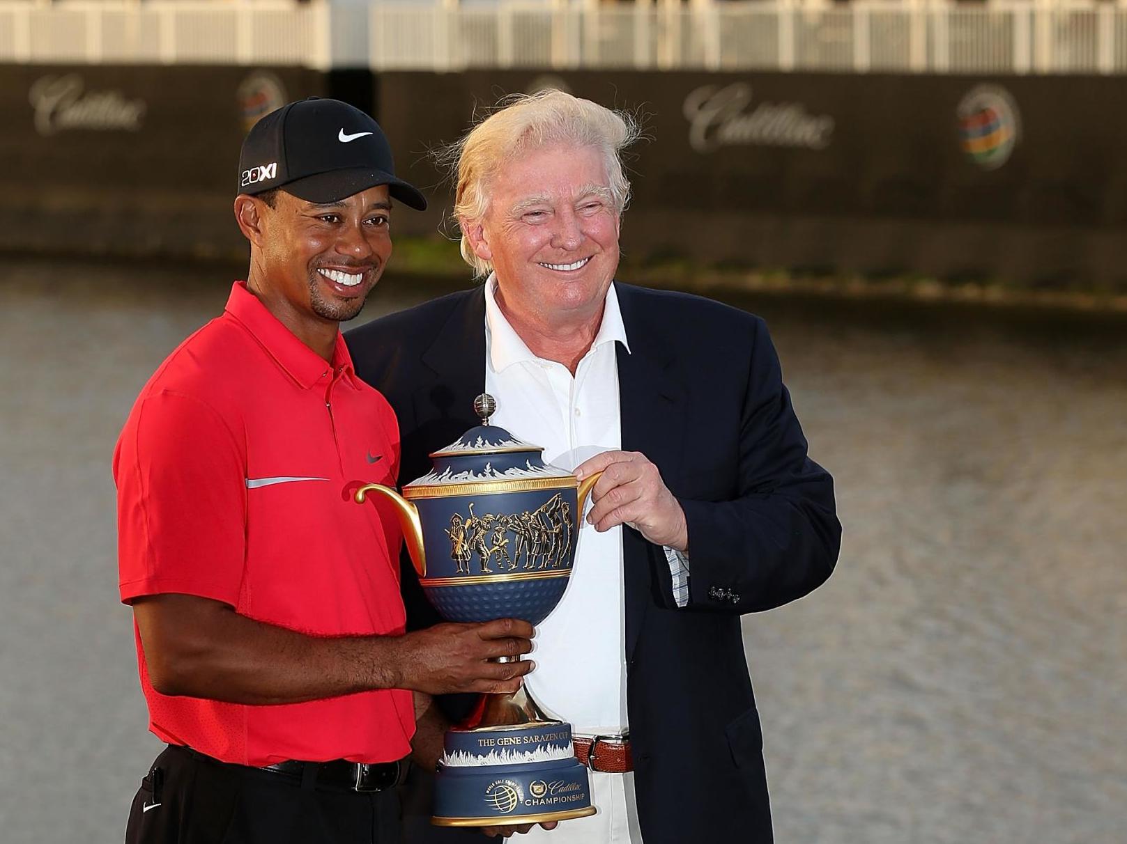 Tiger Woods with Donald Trump in 2013 after winning the Cadillac Championship