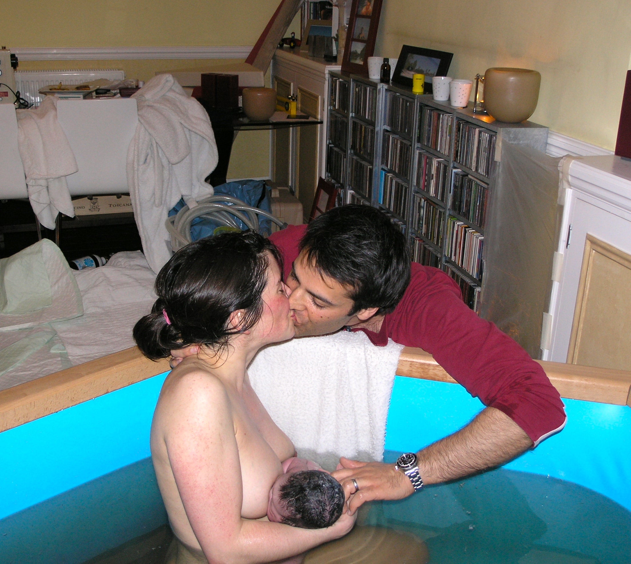 Sara in her hired birthing pool, with her husband, after giving birth