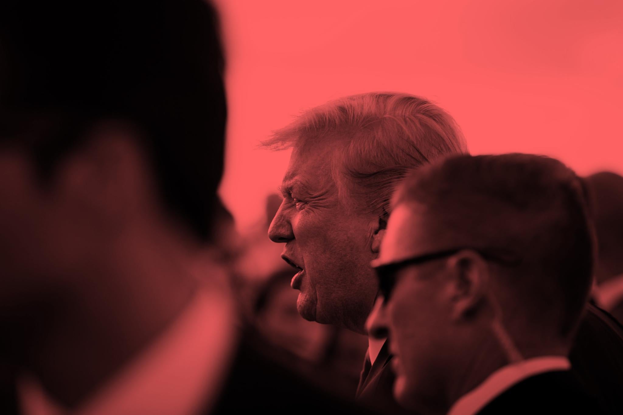 U.S. President Donald Trump greets supporters on the tarmac at Palm Beach International Airport, as he arrives to spend Easter weekend at his Mar-a-Lago club, Florida