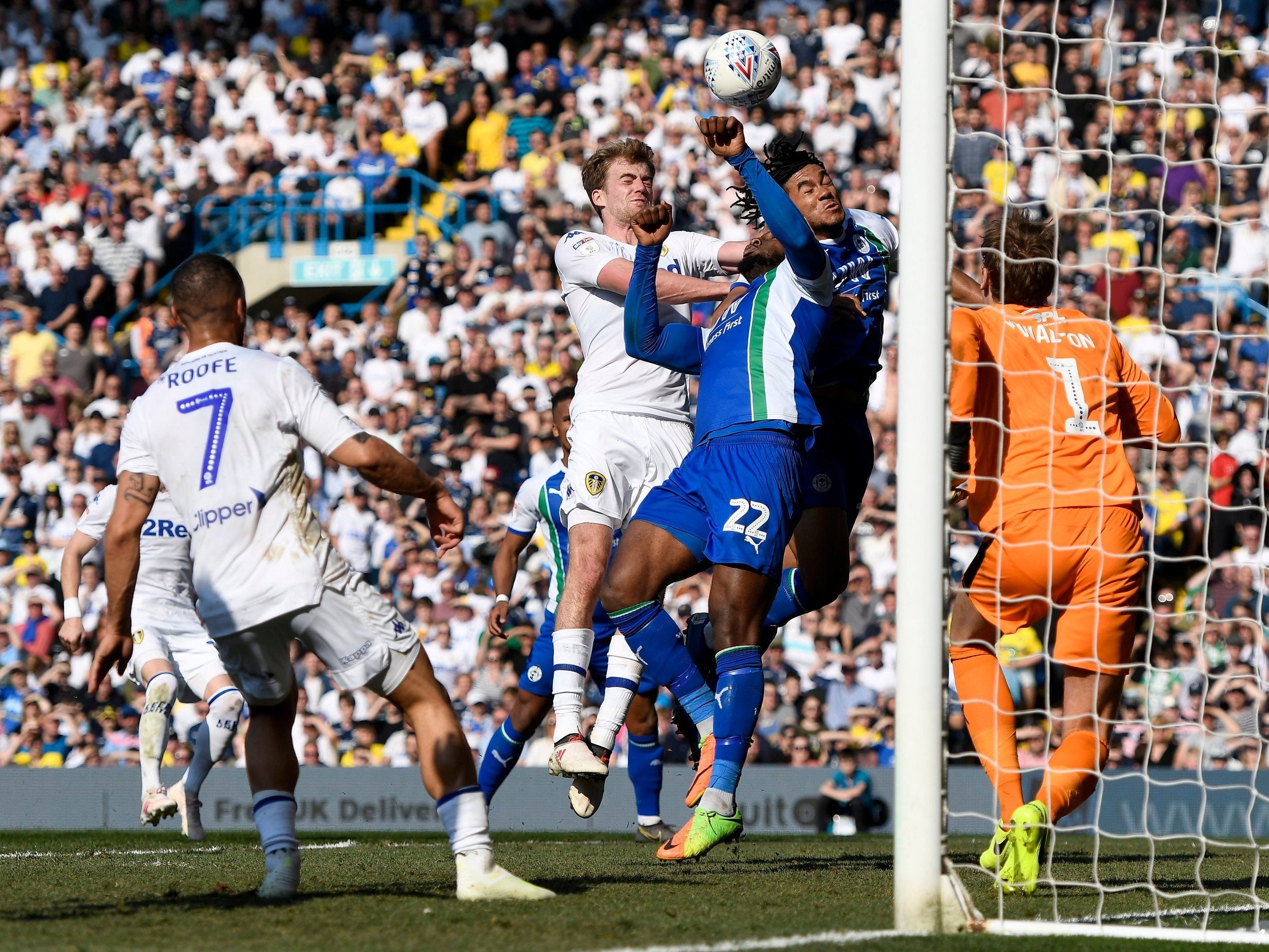 Patrick Bamford competes in the air for the ball with Cheyenne Dunkley and Reece James