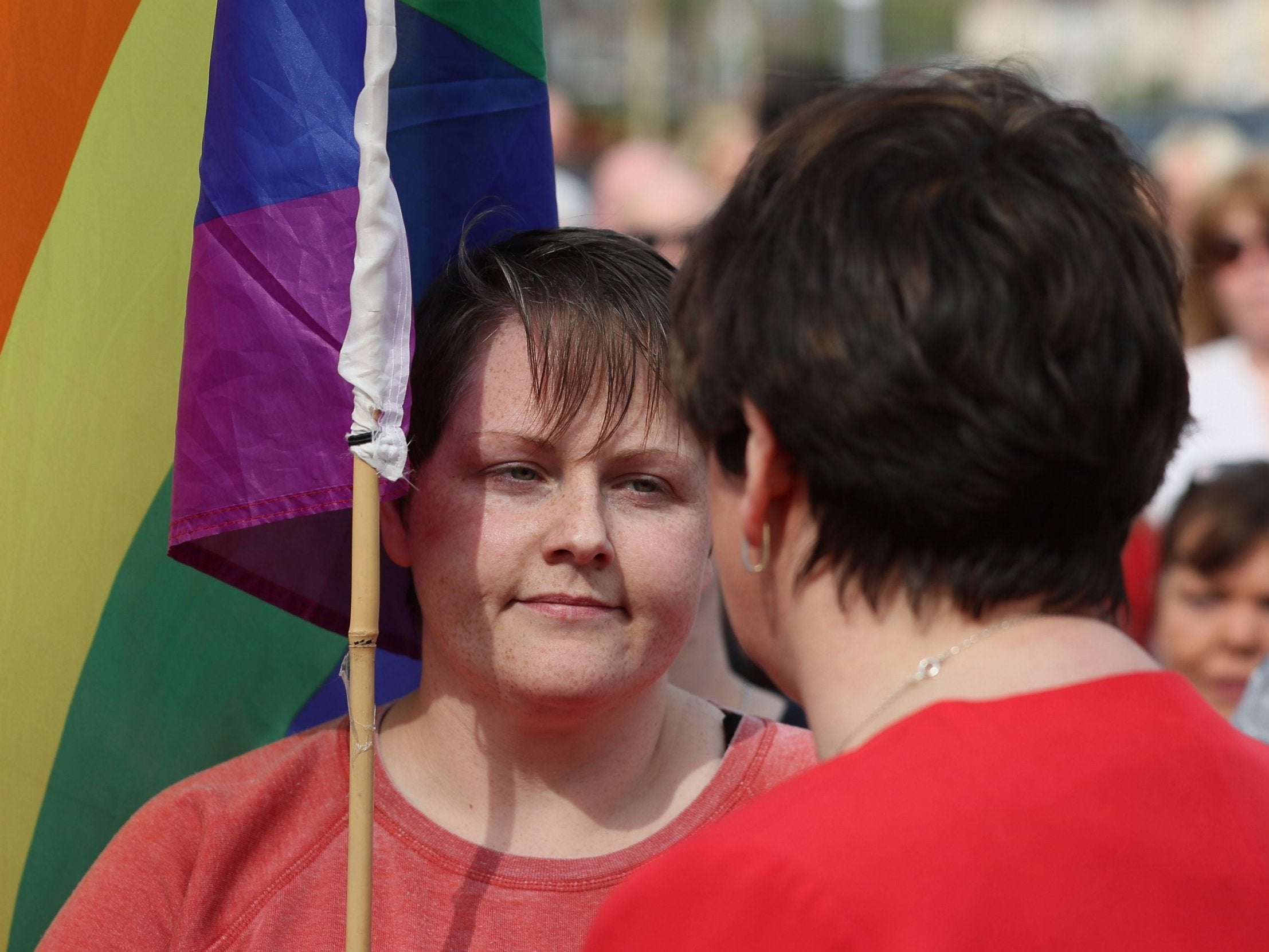 DUP leader Arlene Foster speaks with Sara Canning (left), the partner of journalist Lyra McKee, at a vigil