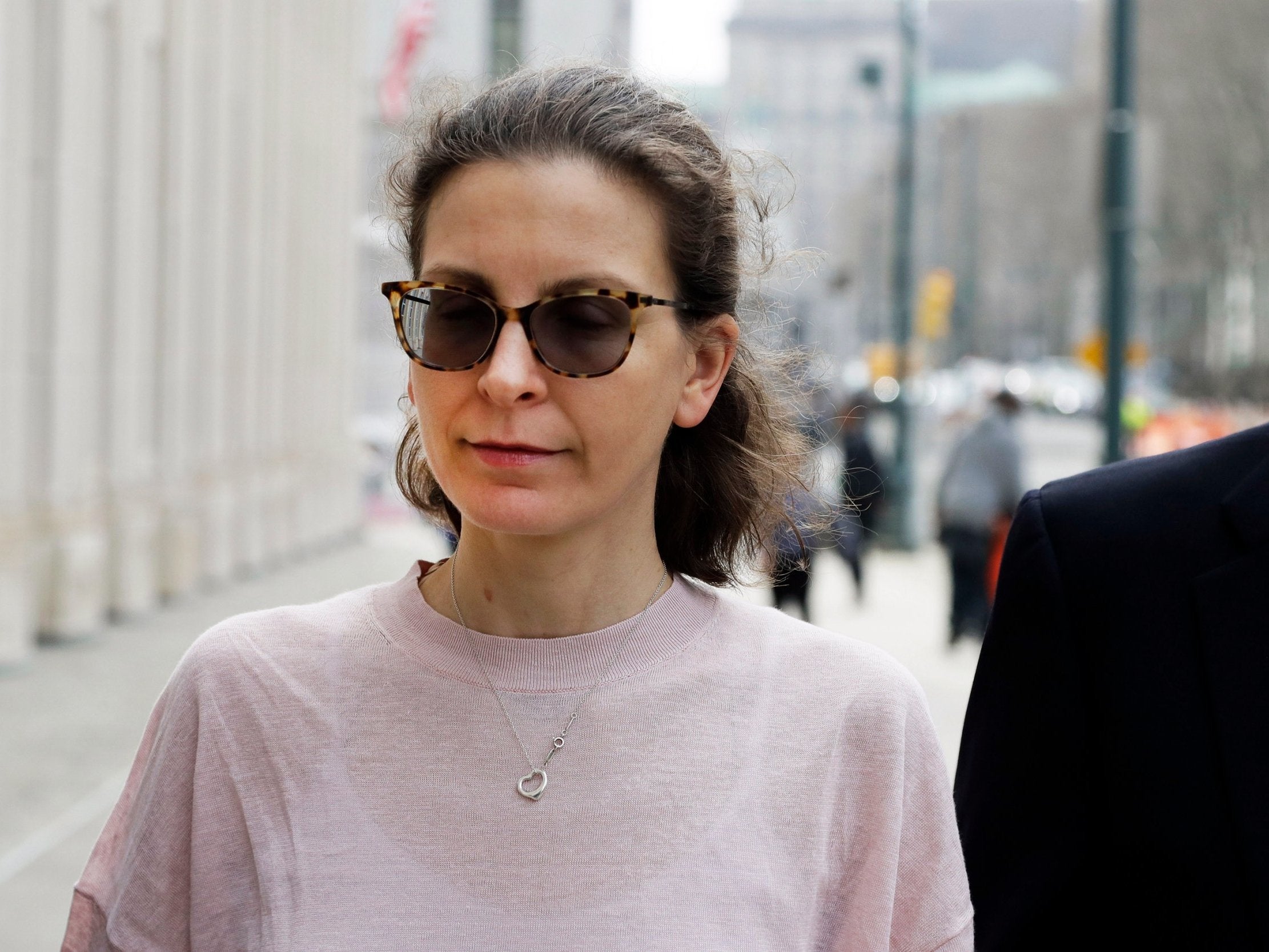 Seagram’s alcohol heiress Clare Bronfman jailed for more than six years for her role in the Nxivm sex cult.