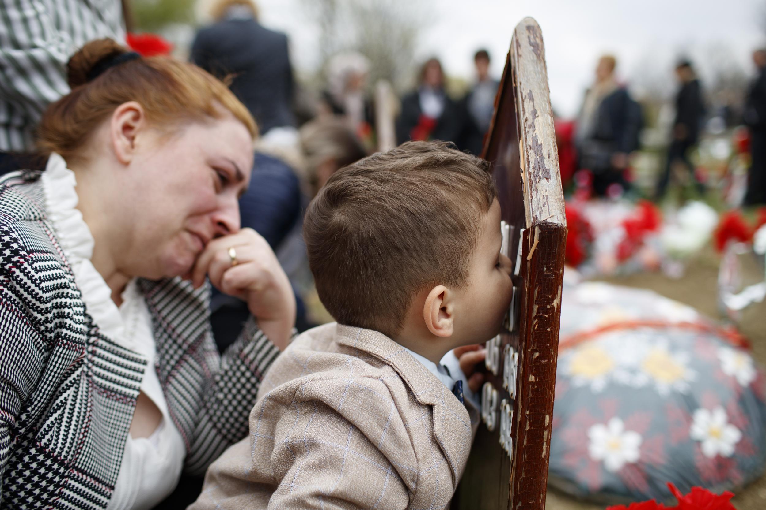 Mourners remember Kosovo Albanian men who were separated from their families and executed in 1999 by Serb security forces