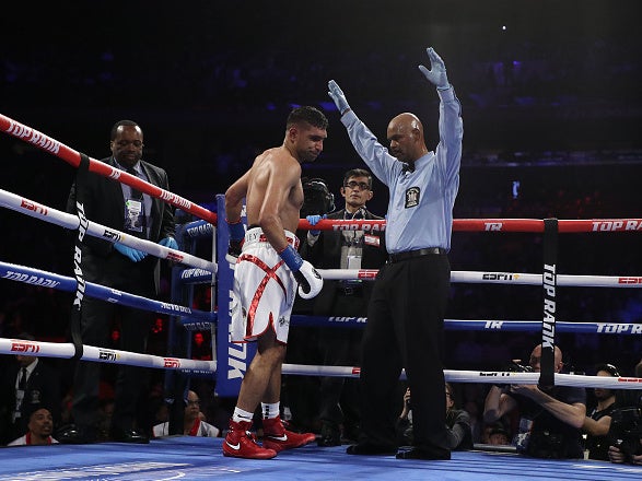 The referee waves off the contest