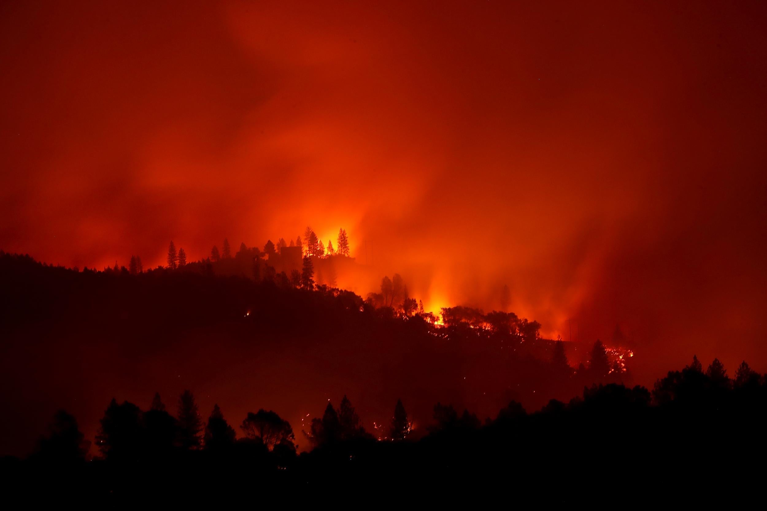 "On the third day of the Camp Fire the flames had moved away from the town and were burning in the nearby hills. I captured this photo in Big Bend, as the story was shifting away from the fire itself and focusing on trying to locate missing persons and recover remains of those who had perished" - Justin Sullivan
