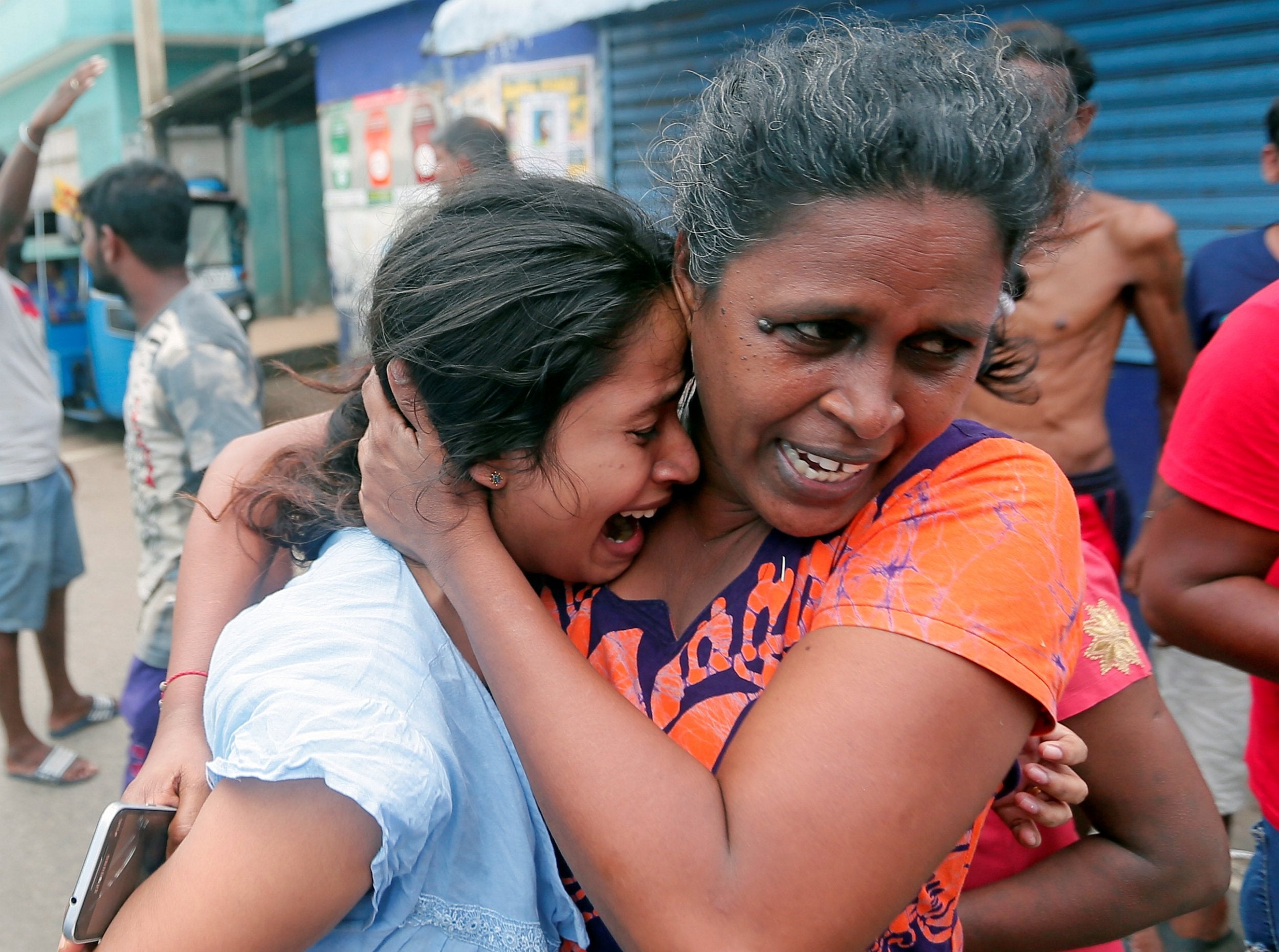 People who live near St Anthony’s church leave their houses as the military try to defuse a suspected van before it explodes in Colombo (Reuters)