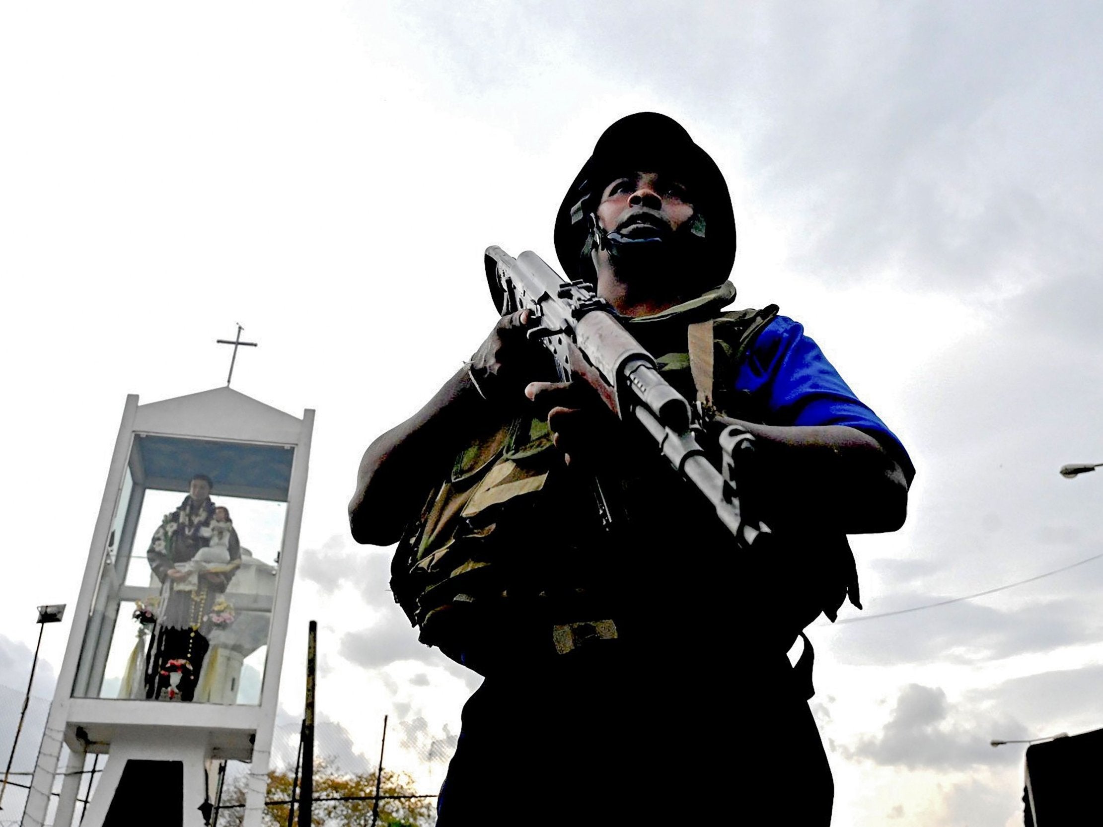 A Sri Lankan soldier stands guard after police tried to defuse a bomb near St Anthony’s Shrine in Colombo on Monday (AFP/Getty)