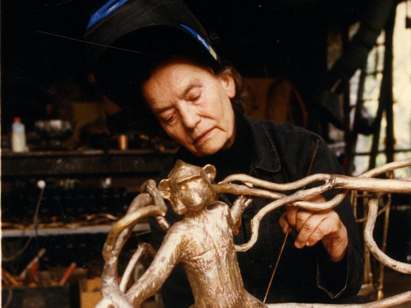 Working on ‘Fauteuil Singeries’ in her studio in Ury, France, in 1998