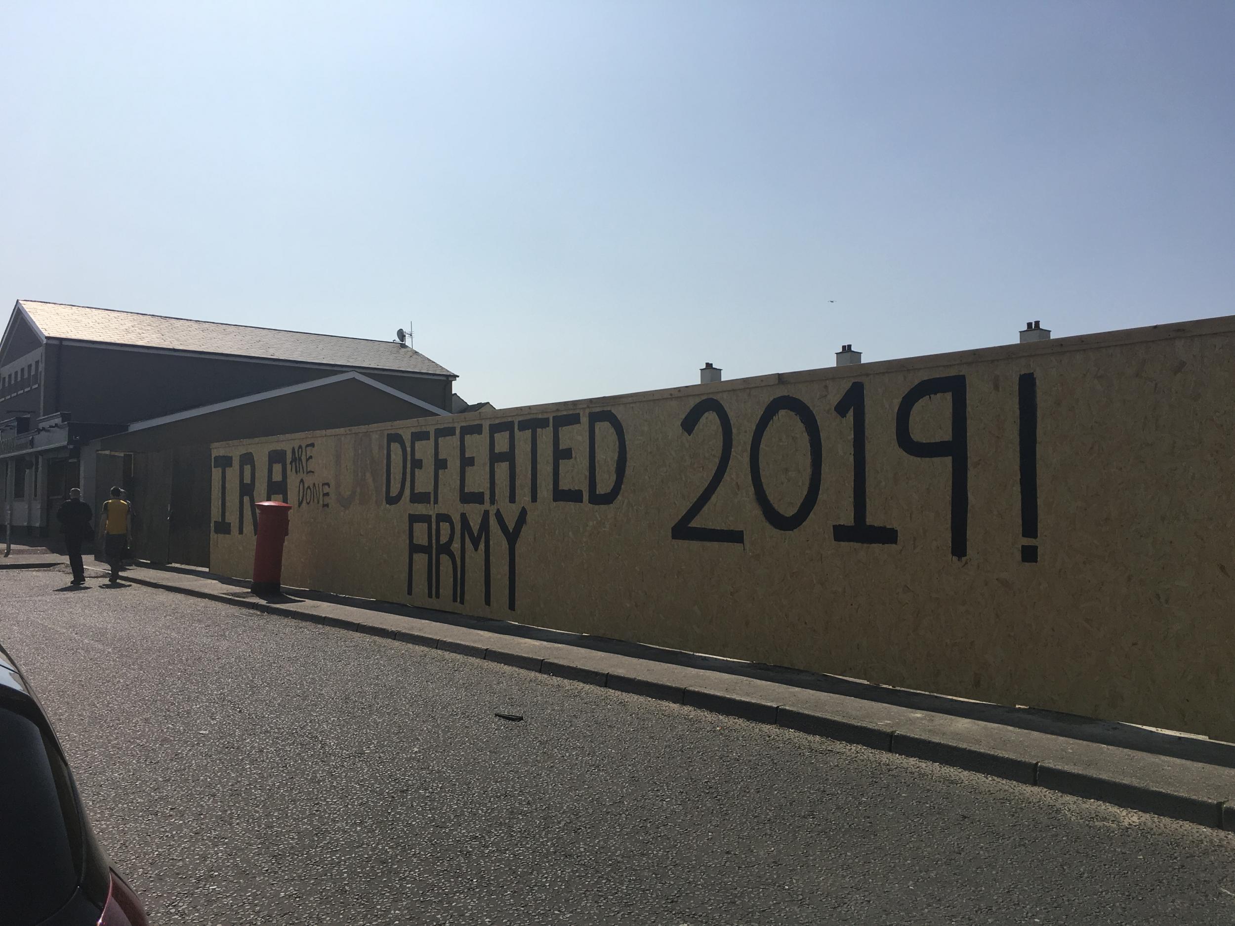 Pro-IRA graffiti on a Creggan wall is altered by locals angered over the death of Lyra McKee