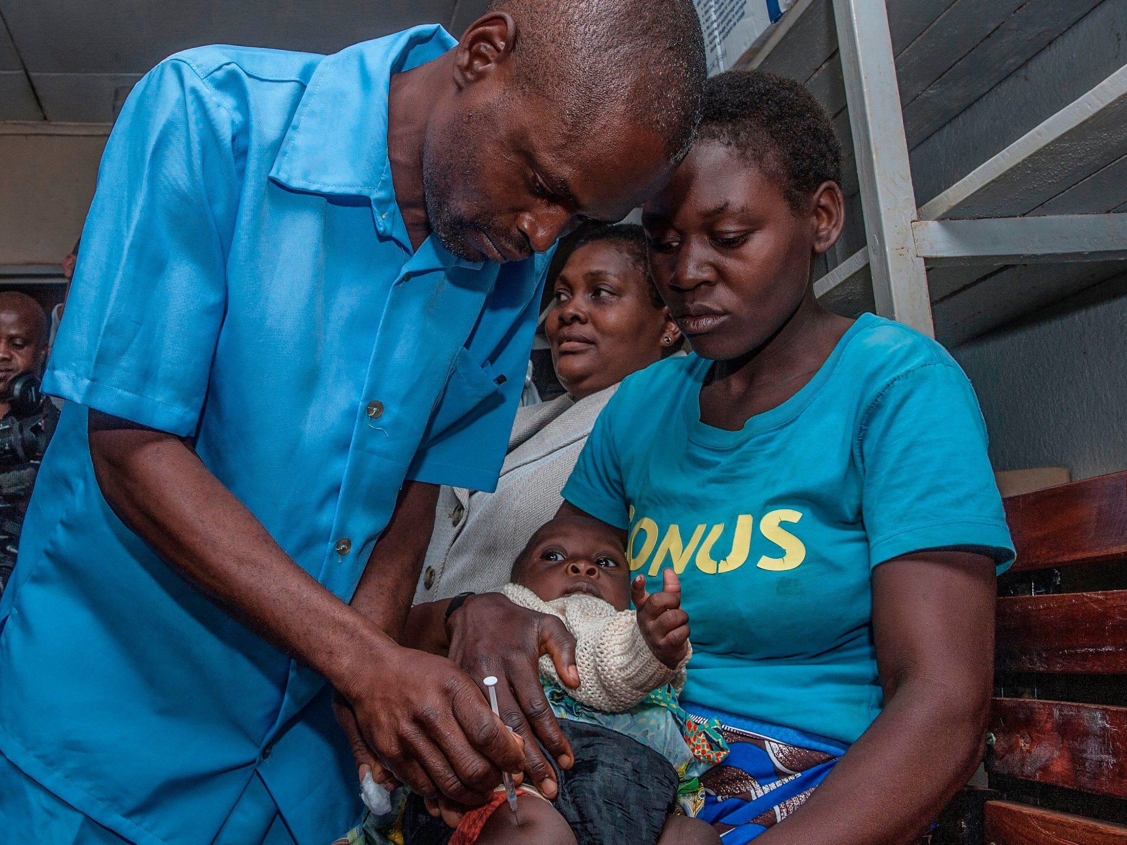 Health worker gives a dose of the malaria vaccine in Malawi's capital Lilongwe