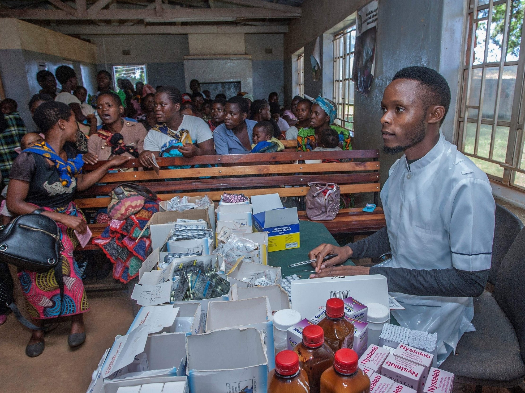 A nurse in Lilongwe waits to administer treatment at the beginning of Malawi's malaria vaccination programme