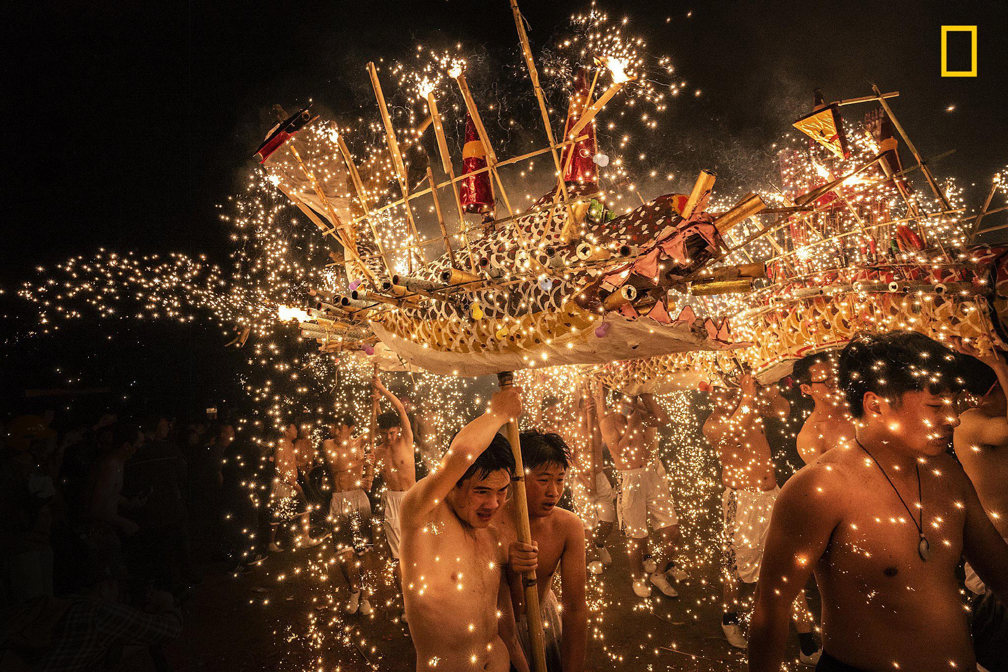 "It was the first full moon night in the Chinese lunar year, symbolizing unity and perfection. People in Meizhou performed a fire dragon dance that showered molten iron, spewing from fireworks—sparks to celebrate the Lantern Festival. This celebration has been performed since the Qing Dynasty and is designated as an Intangible Cultural Heritage" - Léon Kwok