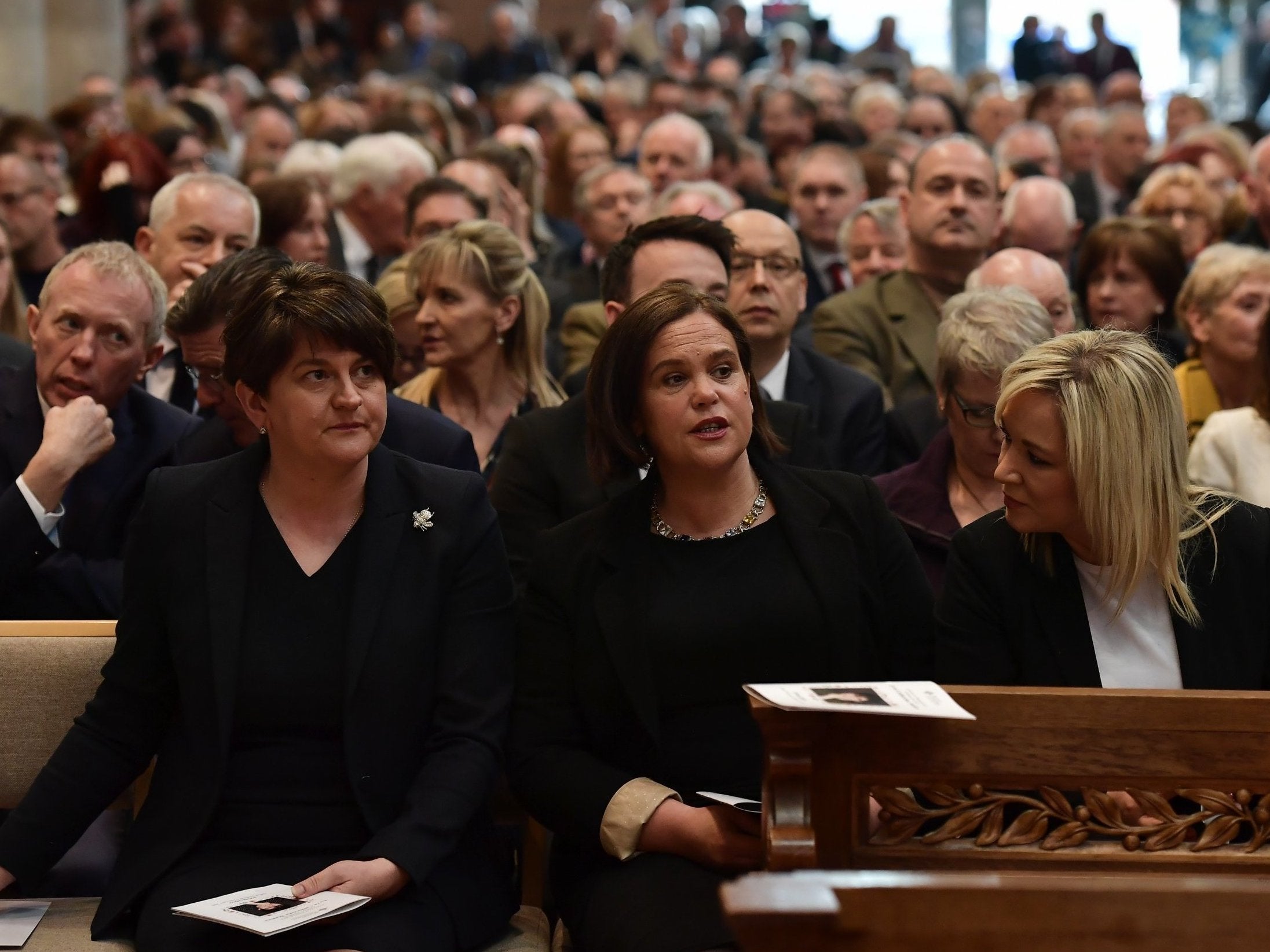 Arlene Foster, leader of the DUP, Mary Lou McDonald, Leader of Sinn Fein and Michelle O'Neill, Vice President of Sinn Fein attend the funeral service of journalist Lyra McKee