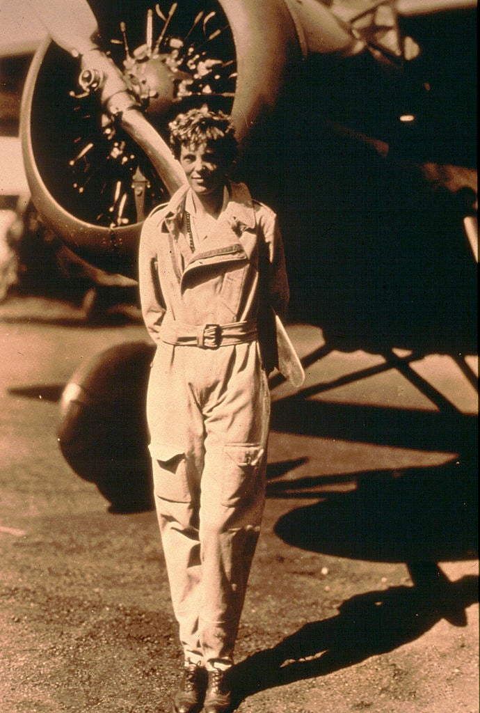 Amelia Earhart pictured standing by her plane in 1935.