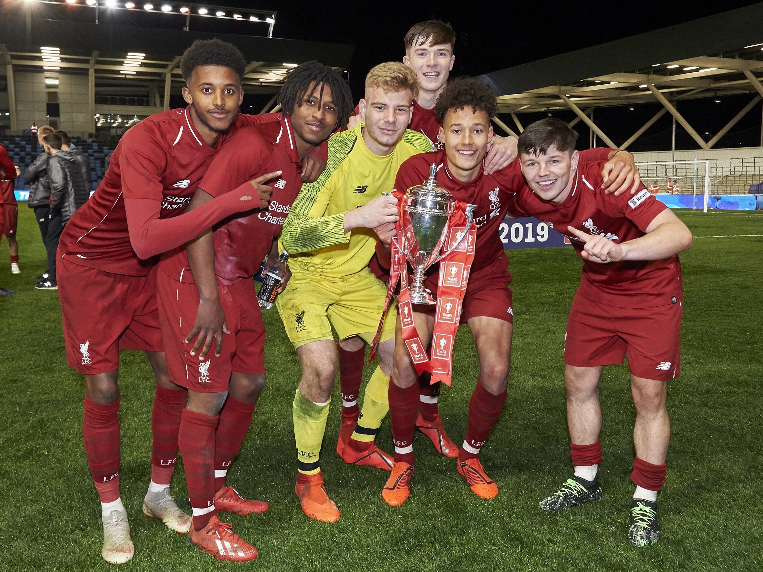 Members of Liverpool's Under-18s celebrate beating Manchester City to win the FA Youth Cup final