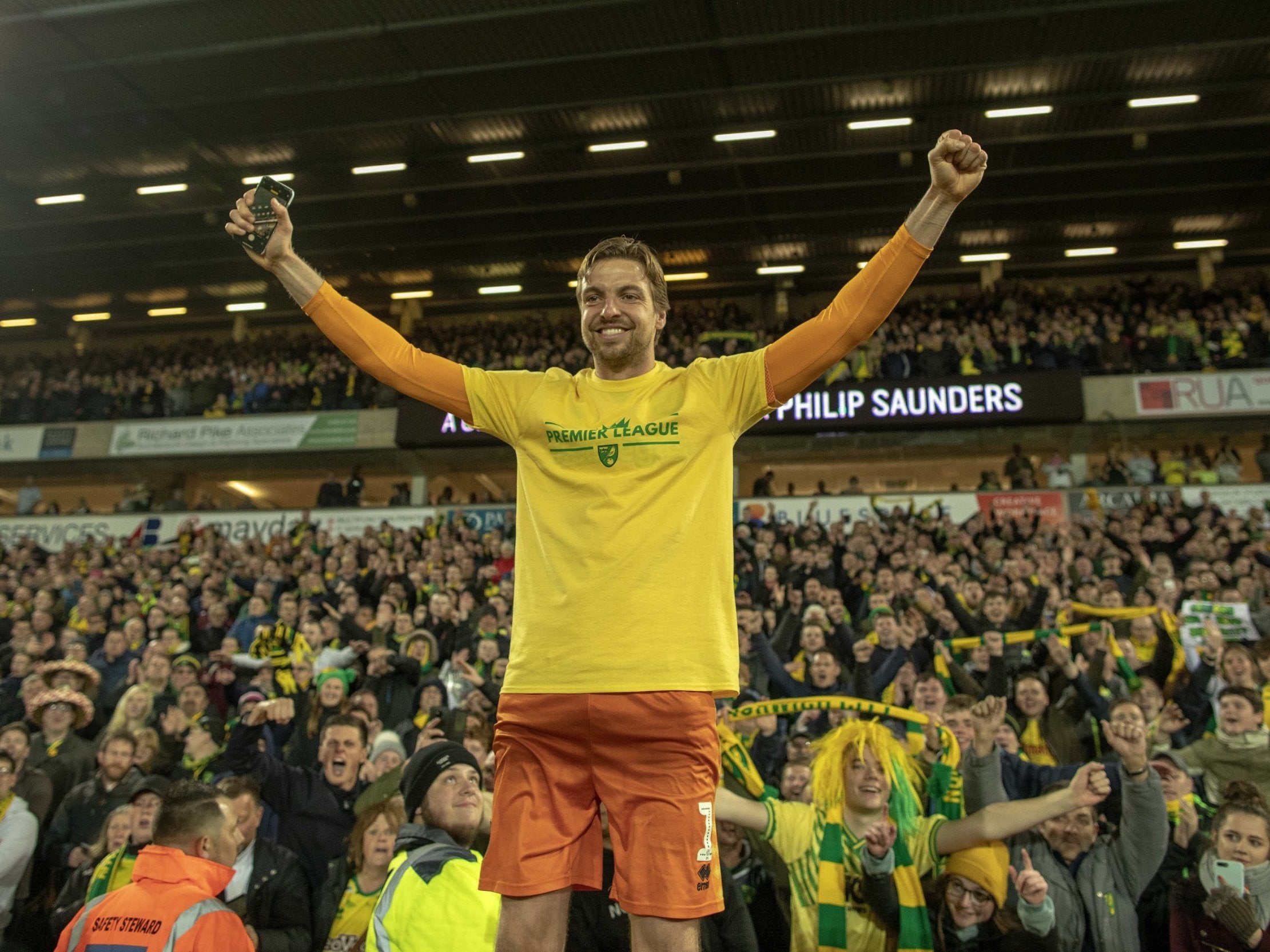 Tim Krul celebrates with the crowd at Carrow Road