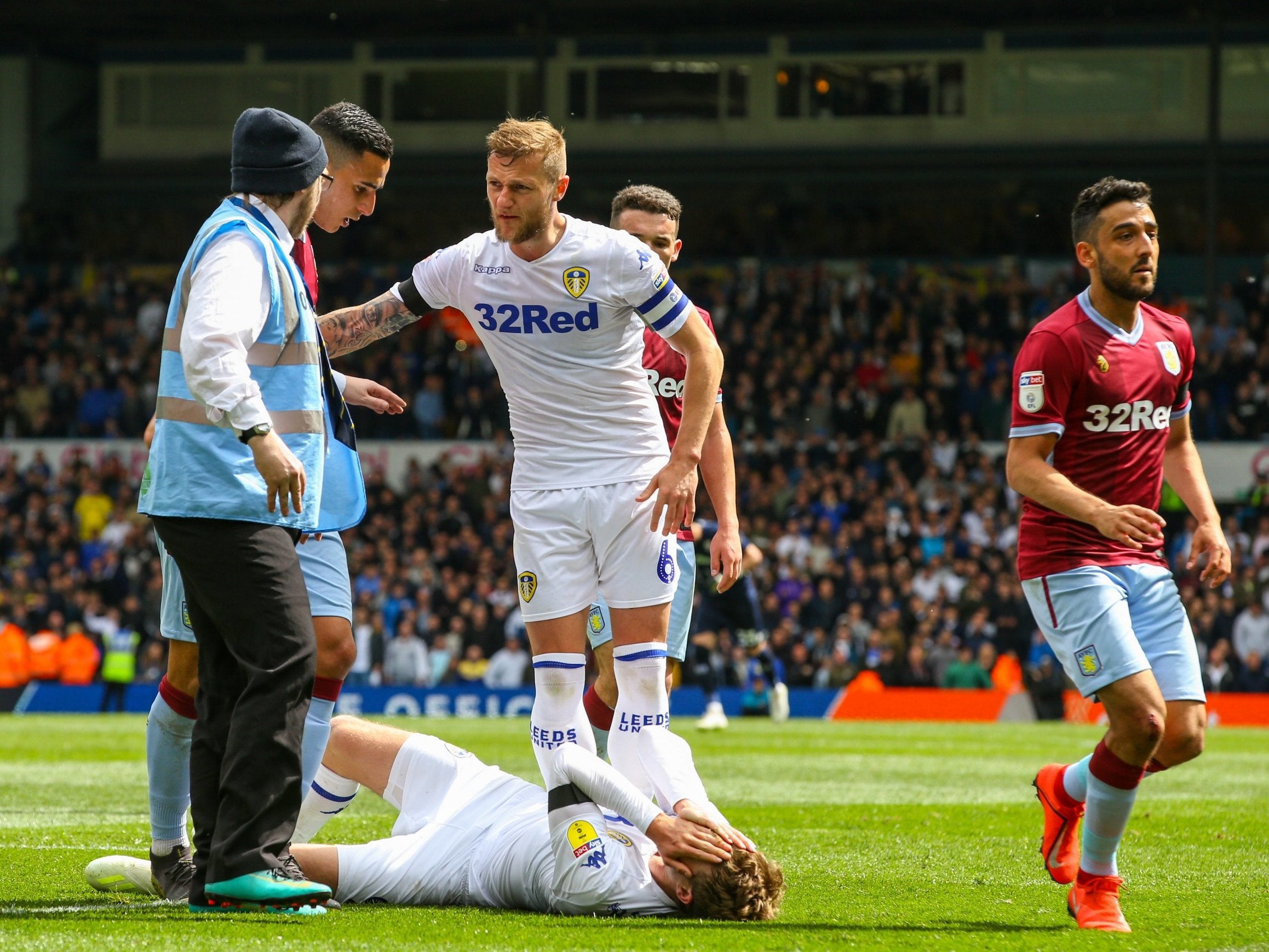 Bamford goes down after an ‘elbow’ from El Ghazi