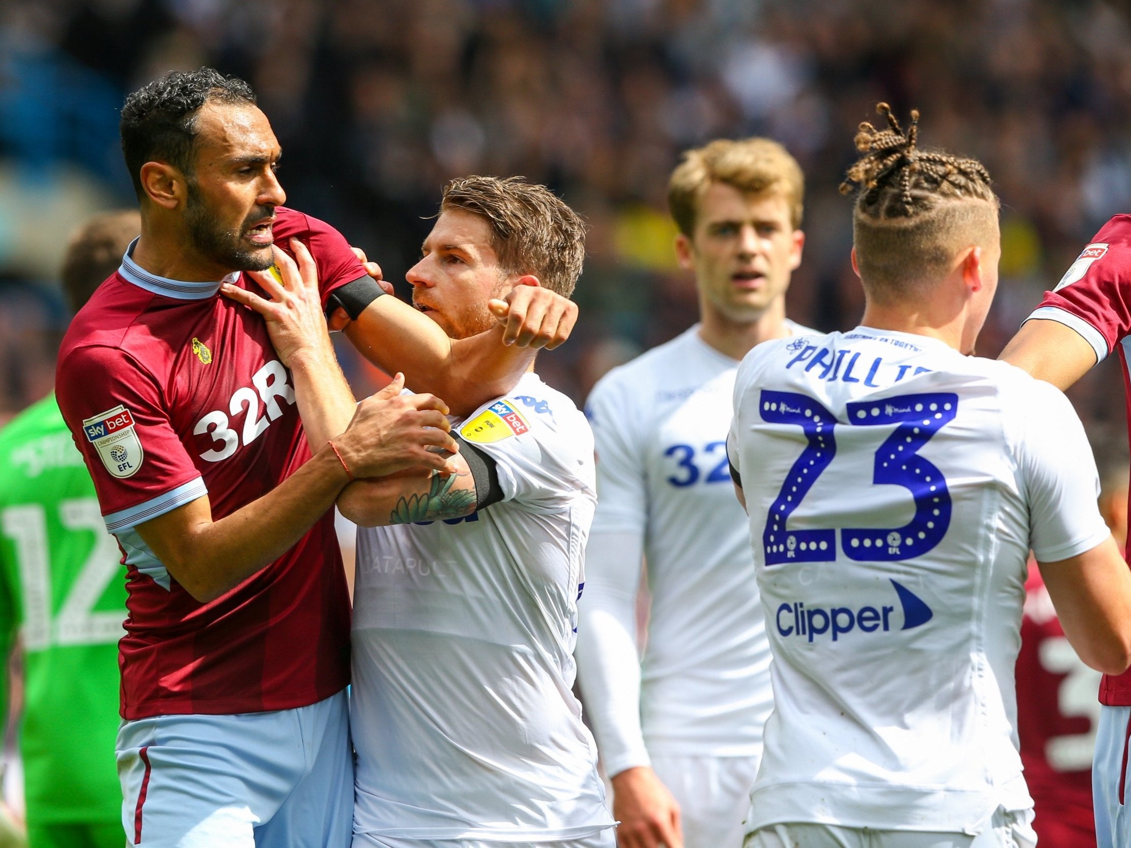 The players clash on the pitch