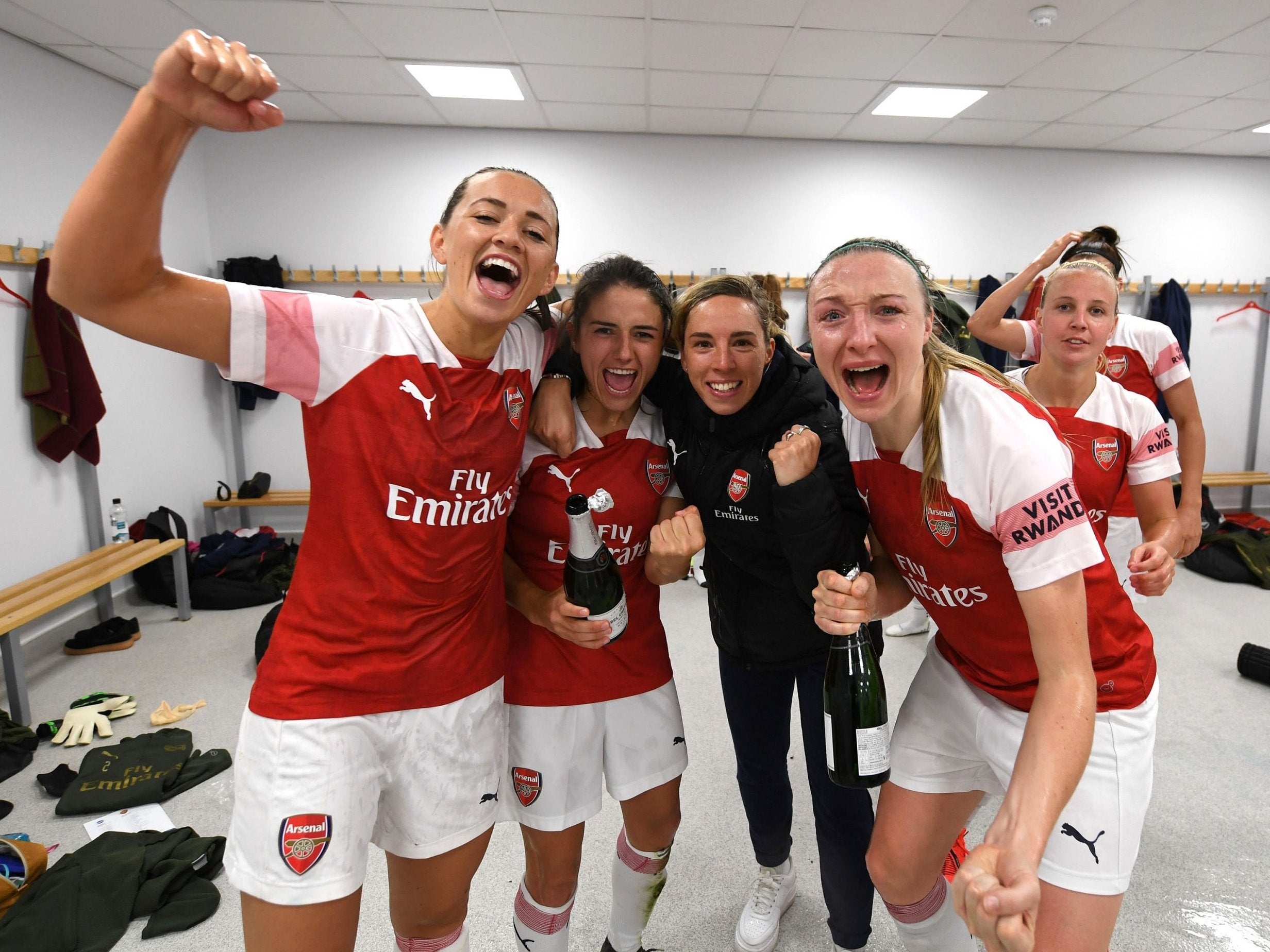 Arsenal players celebrate clinching the title