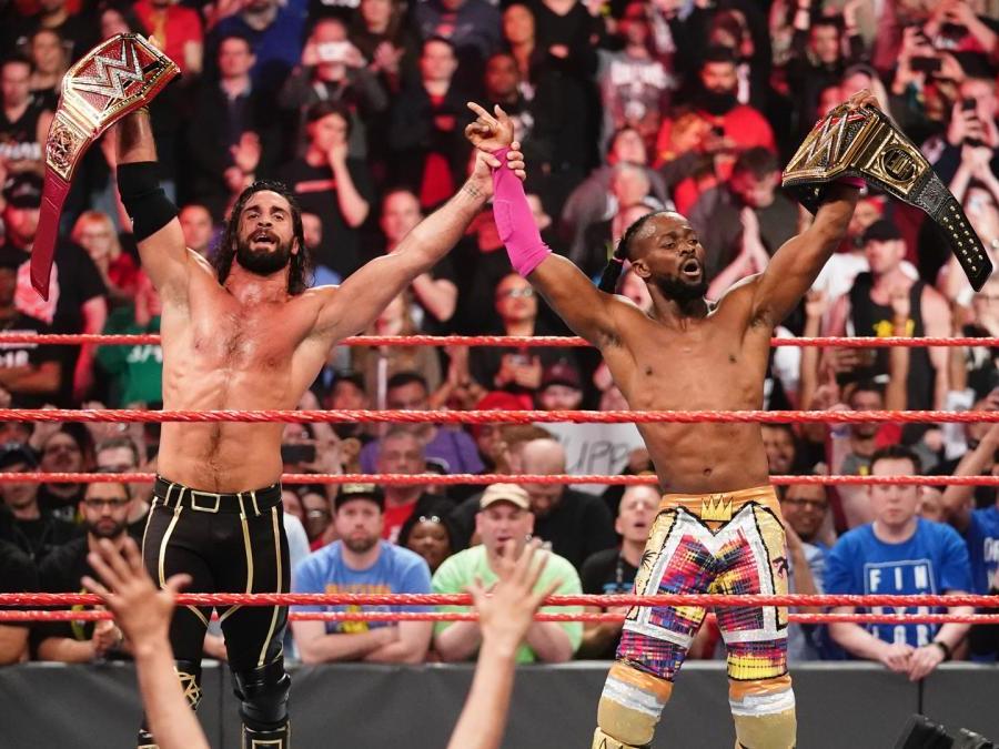 Seth Rollins and Kofi Kingston celebrate