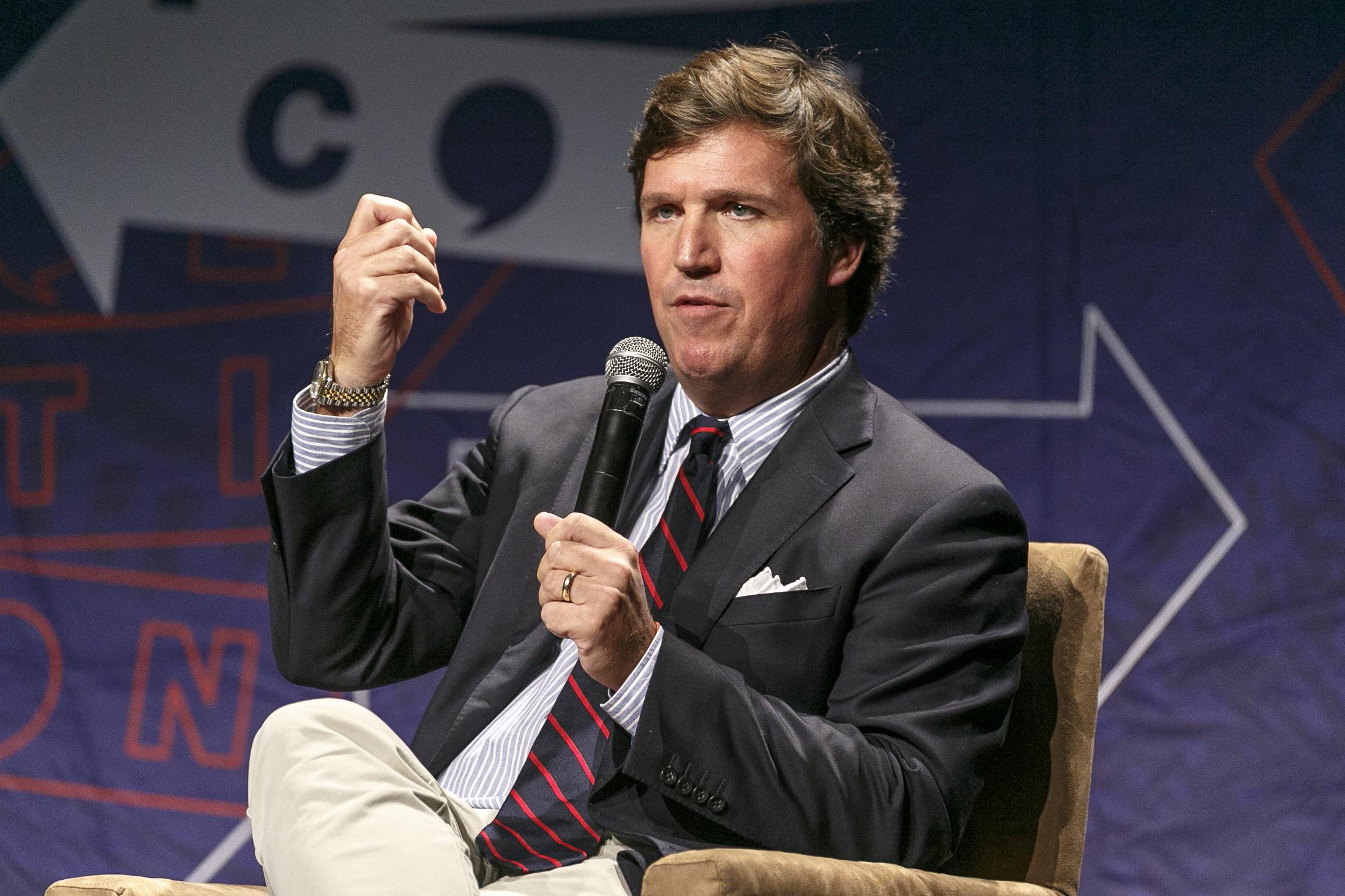 Tucker Carlson speaks during Politicon 2018