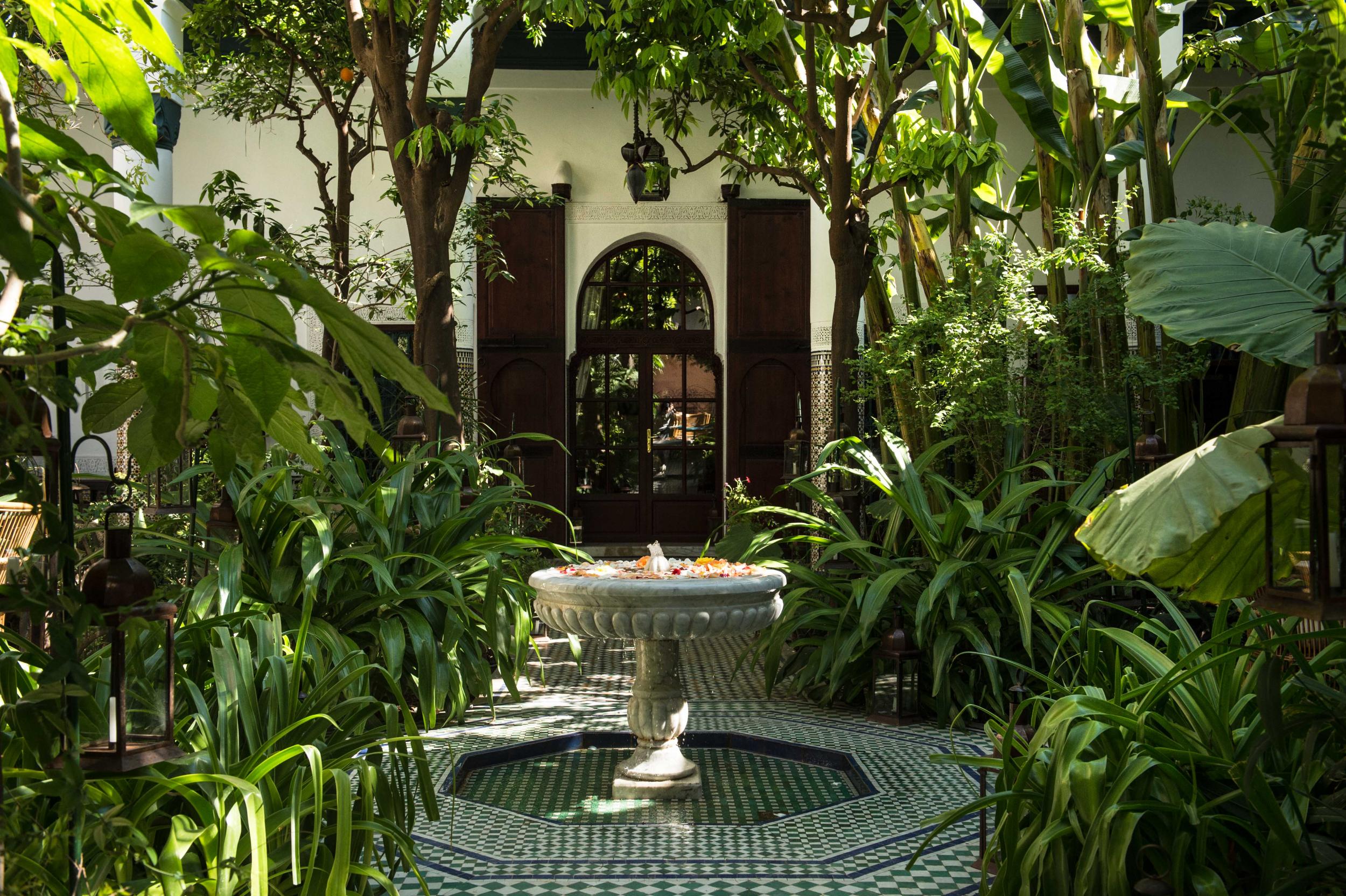 The lush central courtyard at Palais Lamrani