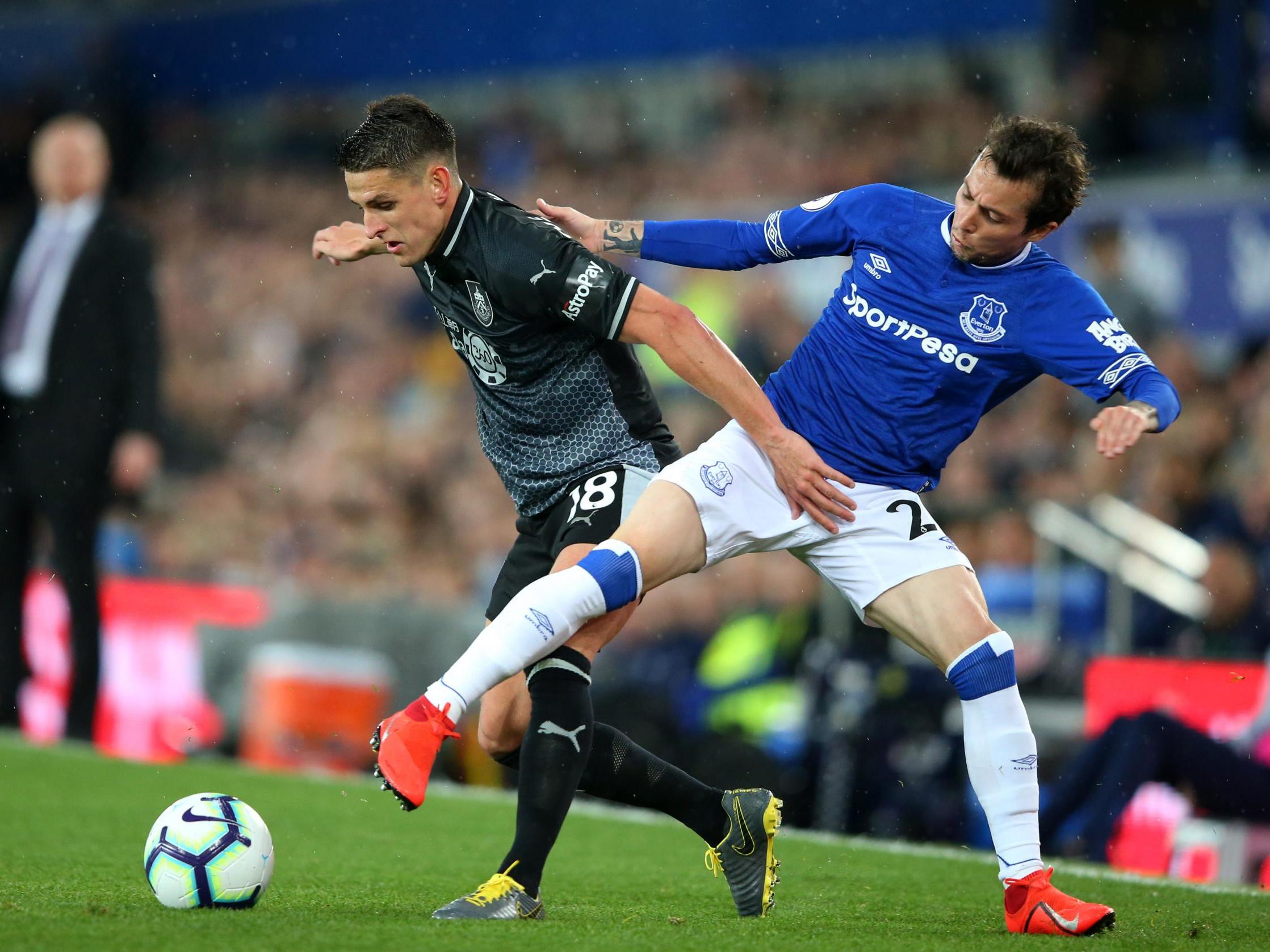 Bernard and Ashley Westwood tussle for possession during the first half