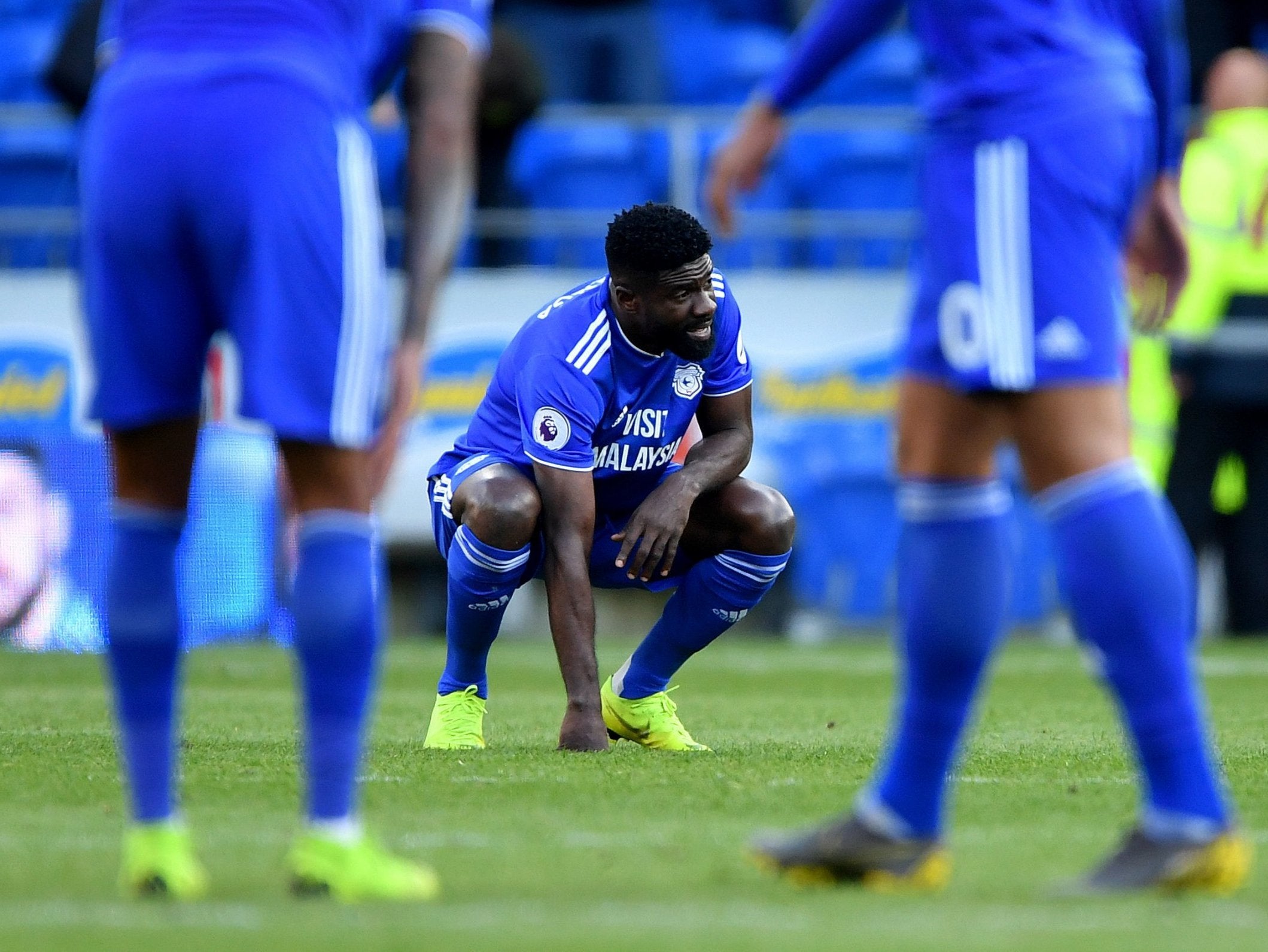 Cardiff City's Bruno Ecuele Manga appears dejected after his team are relegated from the Premier League