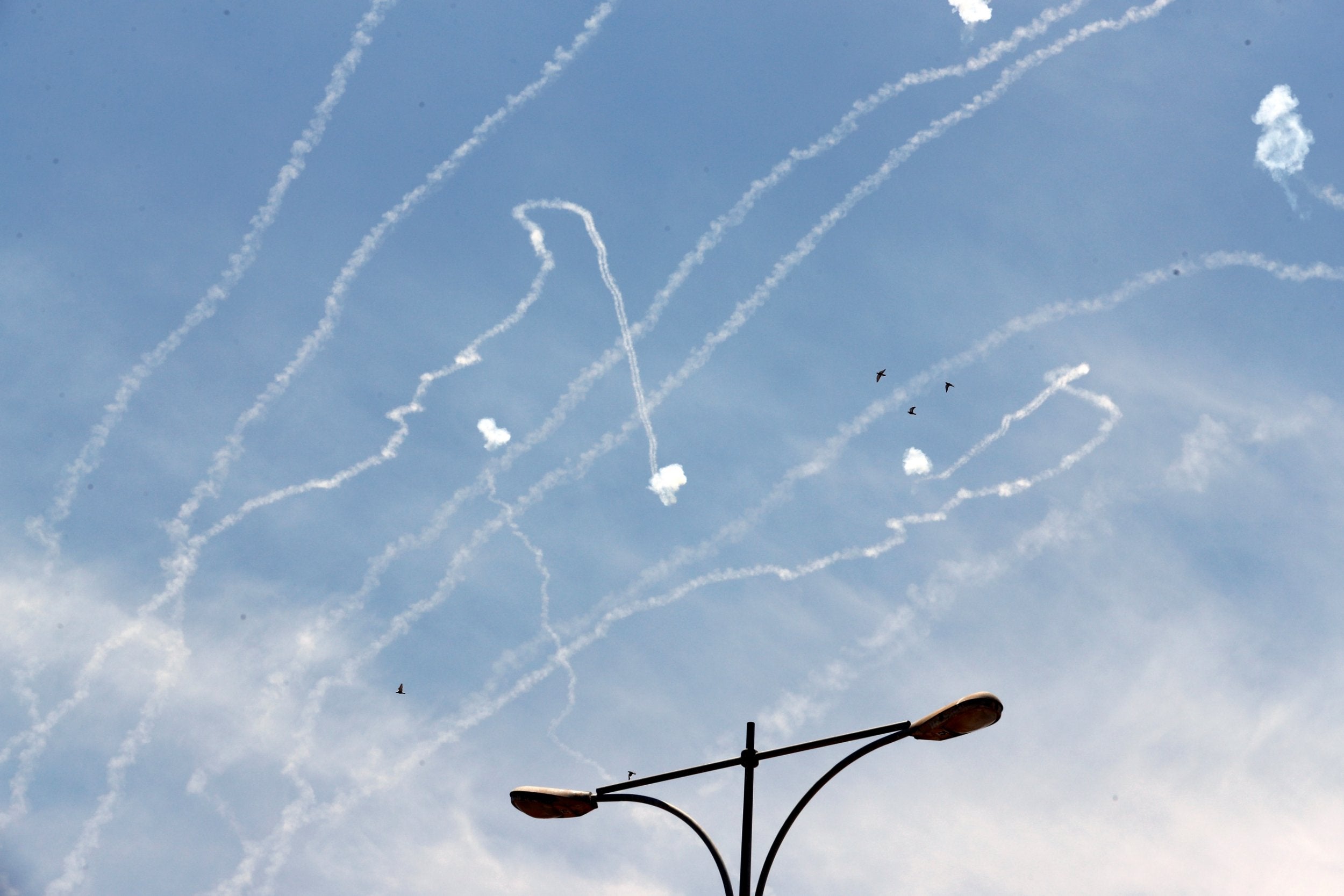 An Iron Dome anti-missile projectile intercepts a rocket fired from Gaza, above Ashkelon (Reuters)