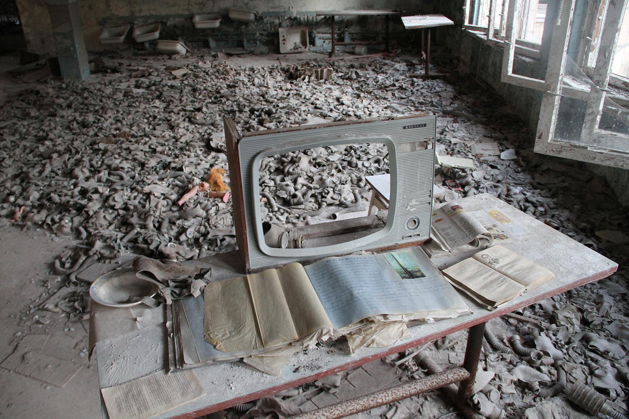 The shell of a television stands inside a building in the Chernobyl exclusion zone